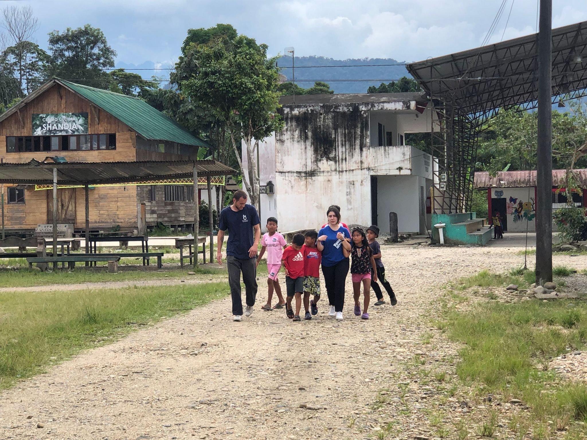 Evan and Paola walking with kids.jpeg