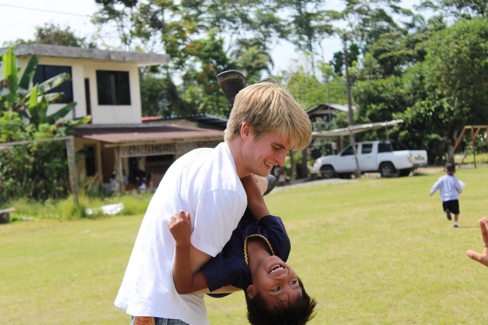 volunteer playing with children.jpeg