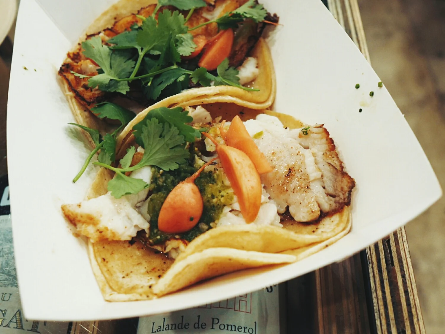 dover sole taco with raw tomatillo chile, pickled radish and cilantro.