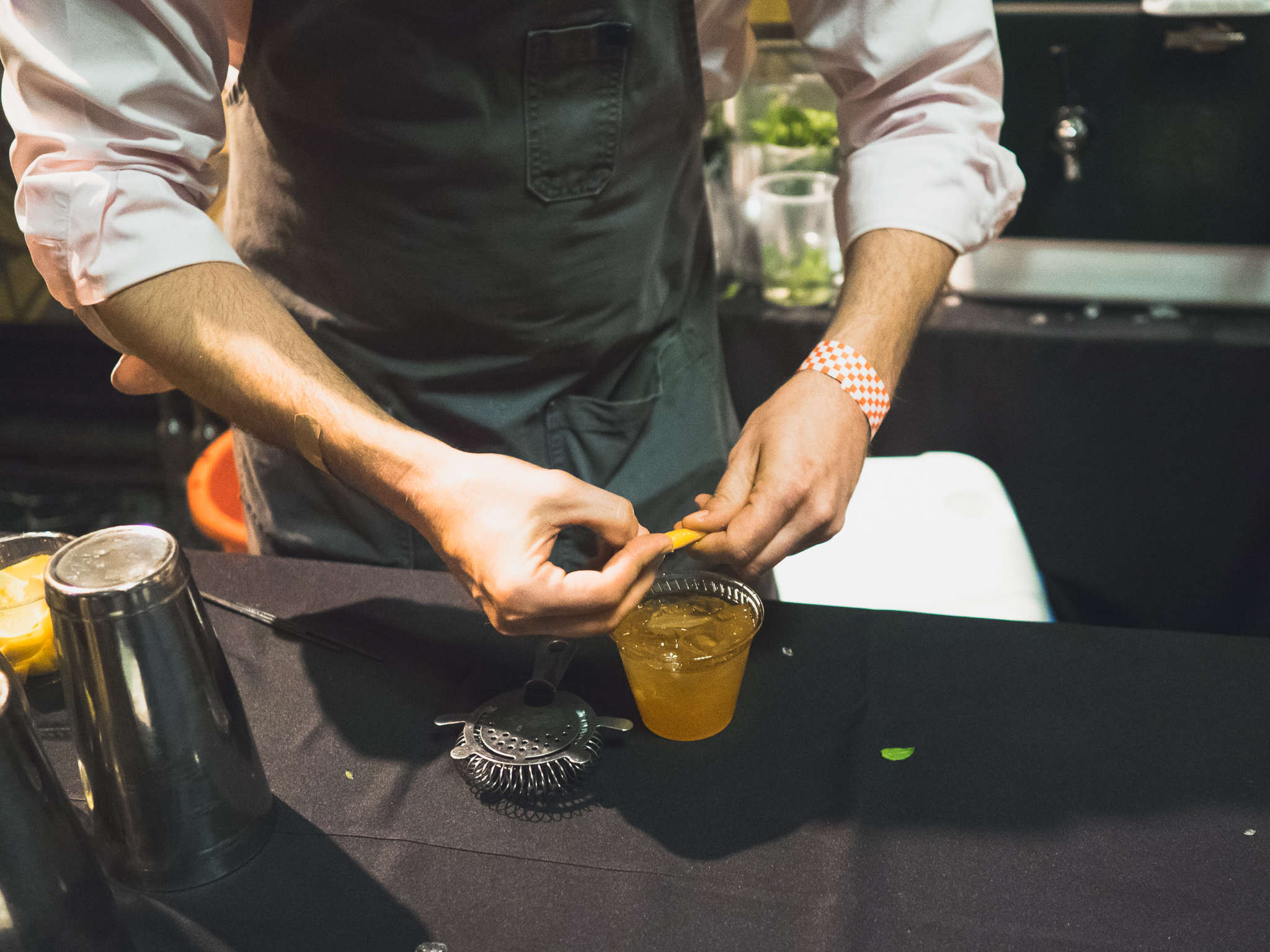 an orange twist for the cardinal punch (buffalo trace bourbon, lustau brandy, grand poppy bitters, roasted orange, clove, champagne, lemon orange essence).