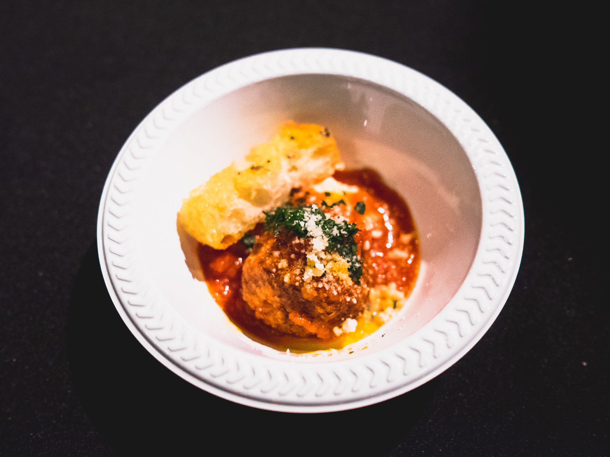 jon and vinny's marinara-based meatball with ricotta and garlic bread.
