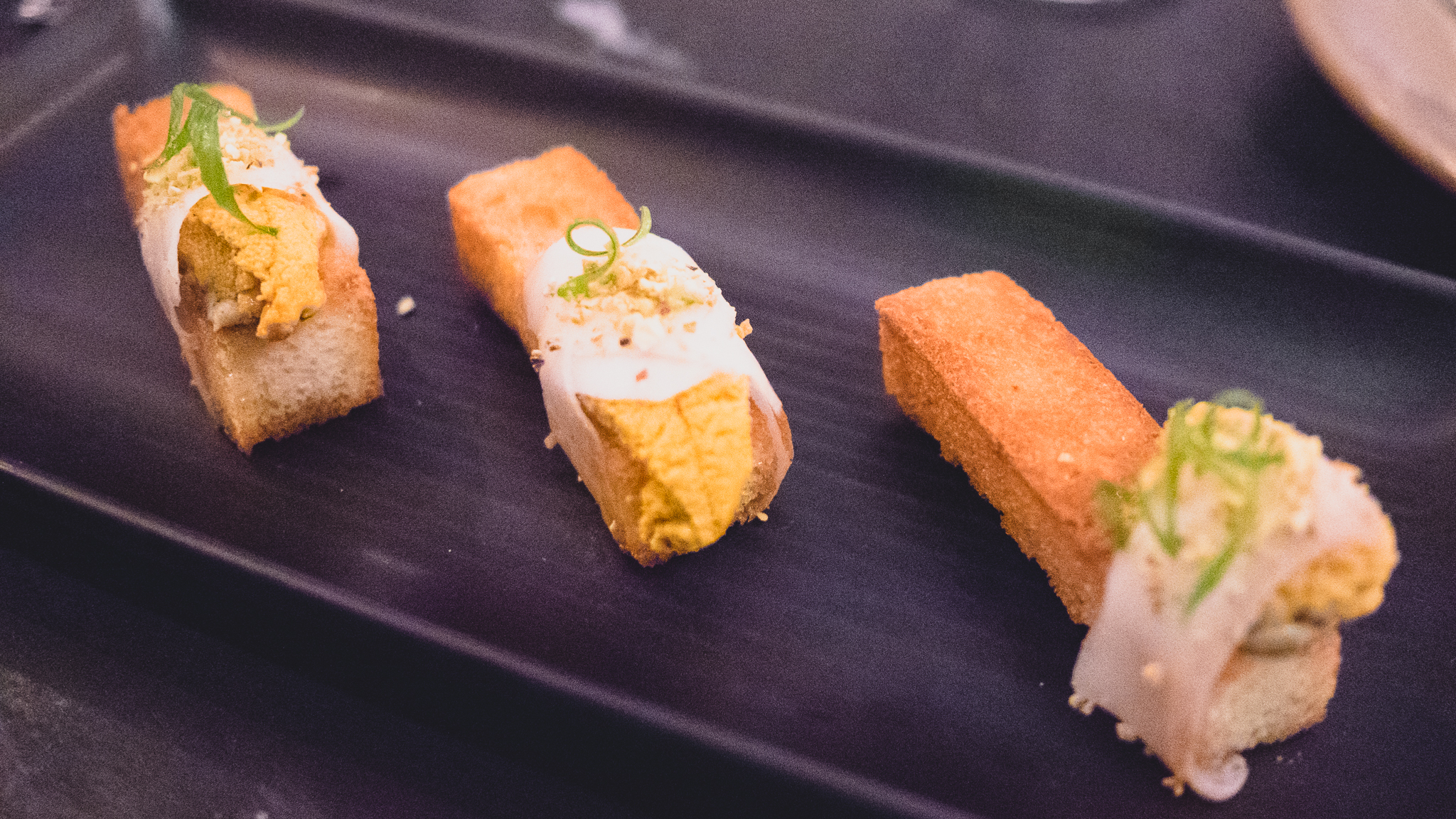 sea urchin on brioche with lardo, pistachio and truffle butter.