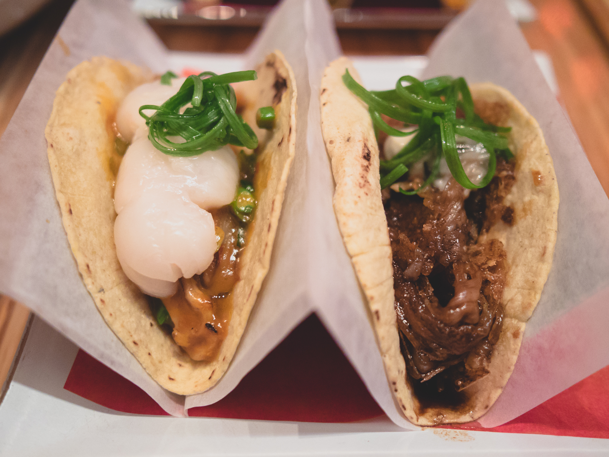 tacos silencio (braised duck tongue, fresh lychee) and viva china (beef tenton, kumamoto oysters).