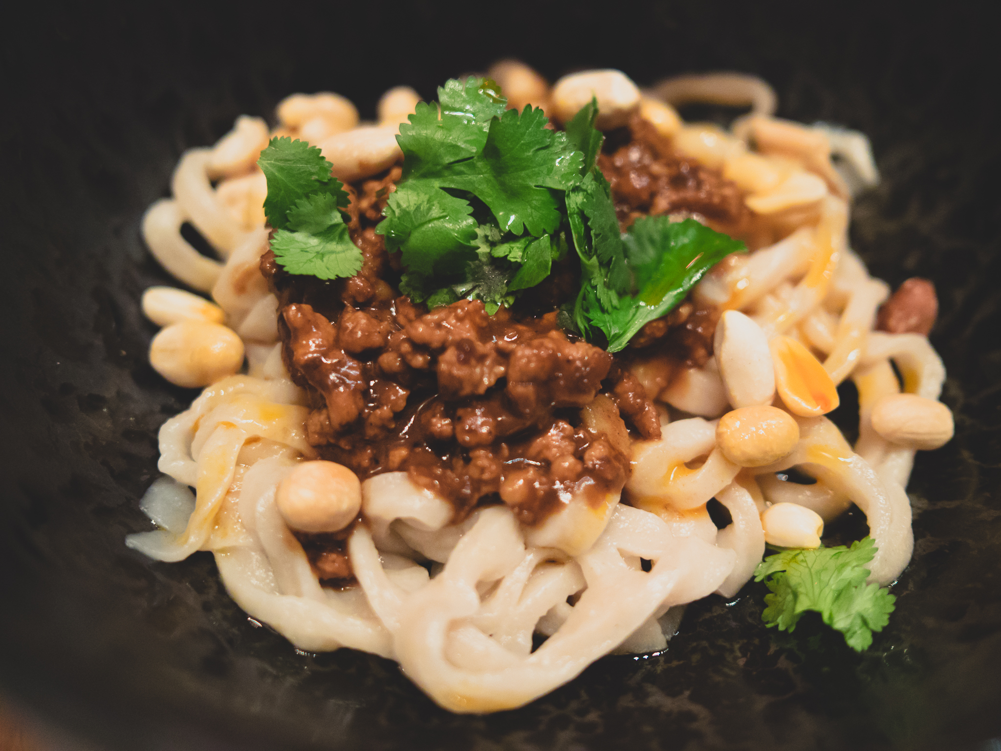 dan dan mian : hand-cut wheat noodles, spicy pork sauce and peanuts.