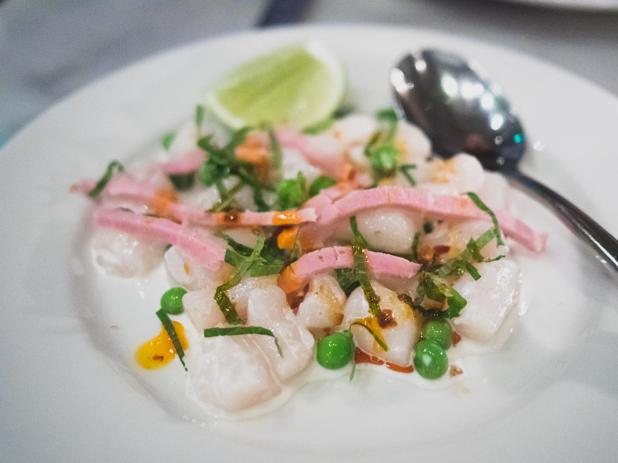 raw spicy scallops with english peas, dried shrimp, ham, mint, chile oil.