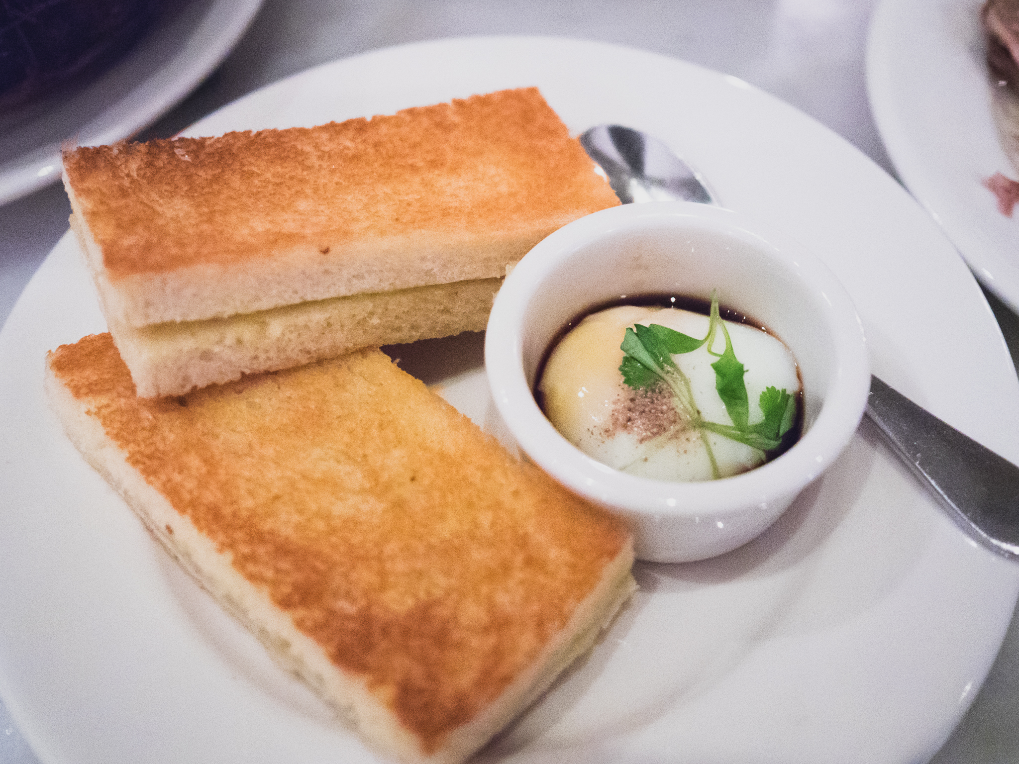 kaya toast with coconut jam, butter, slow cooked egg and soy.