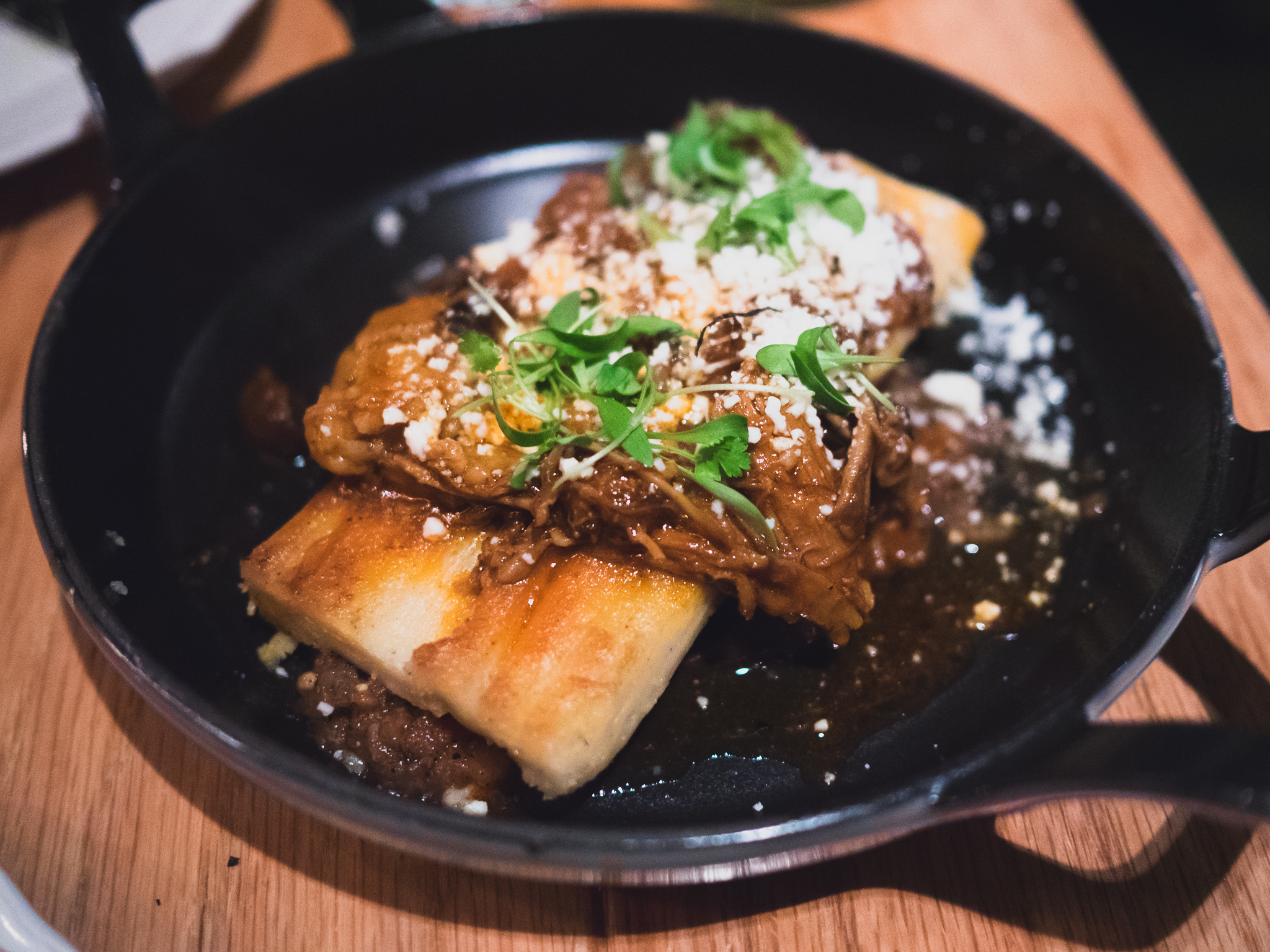 tamale with lamb neck, king oyster mushroom, queso oaxaca.