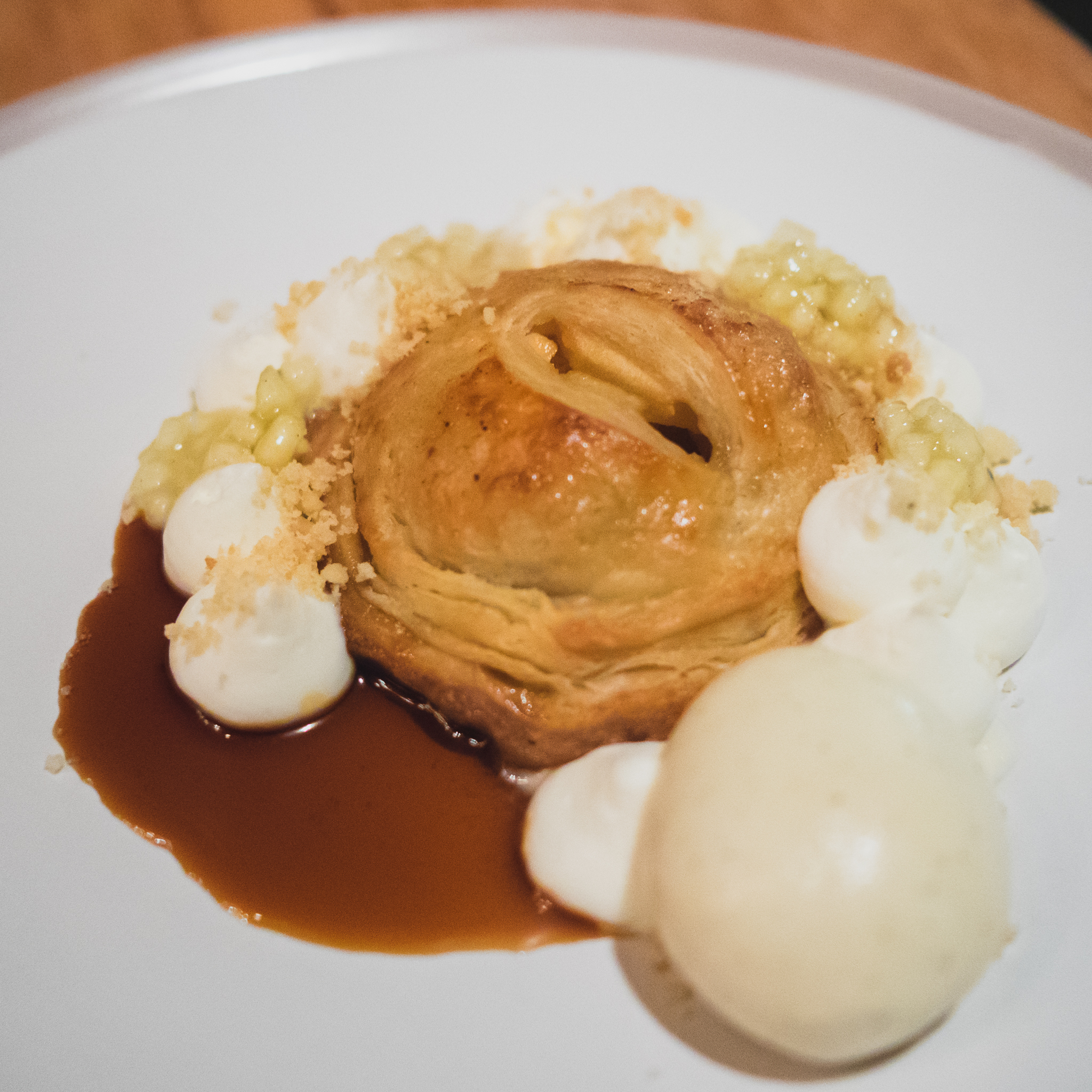 empanada with honey crisp apple, requeson, sherry vanilla ice cream, crema mousse.