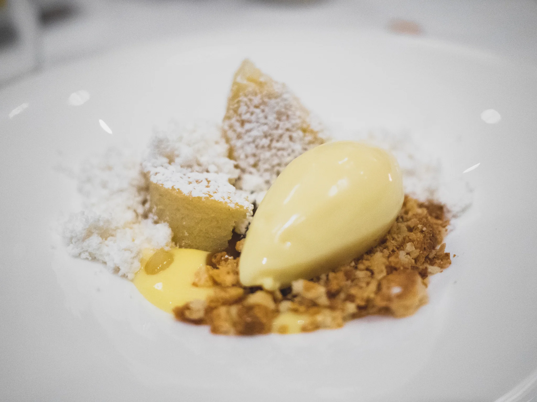mochi cake with sudachi curd, argan, yuzu and toasted coconut ice cream.