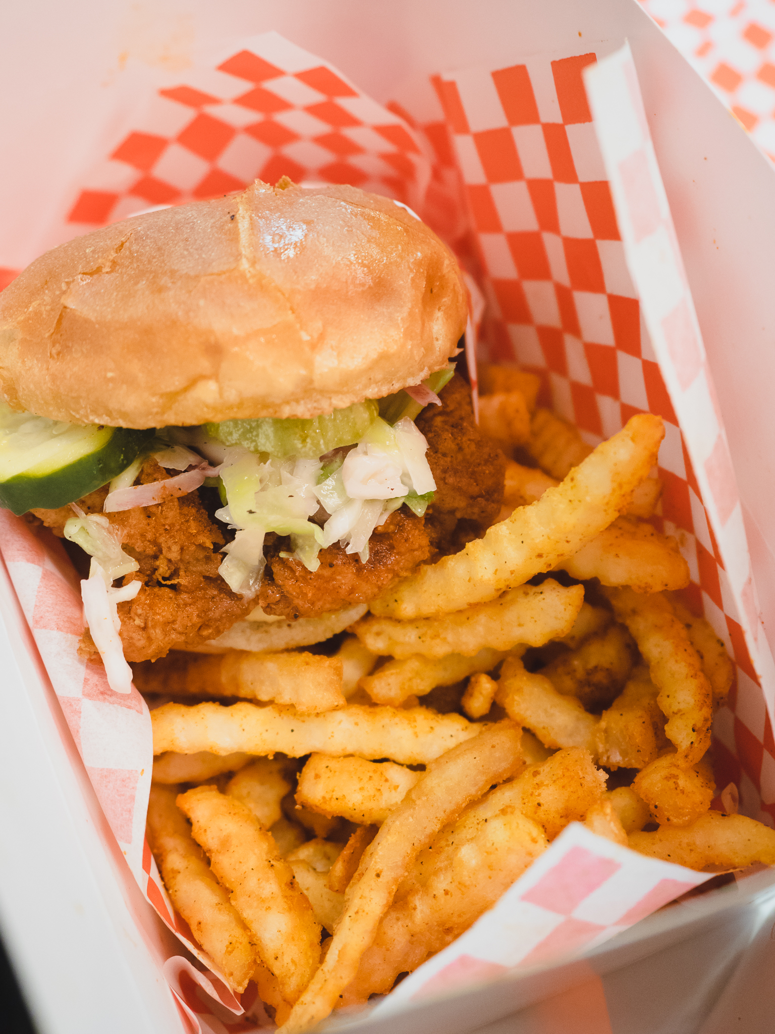 hot chicken sandwich with fries.
