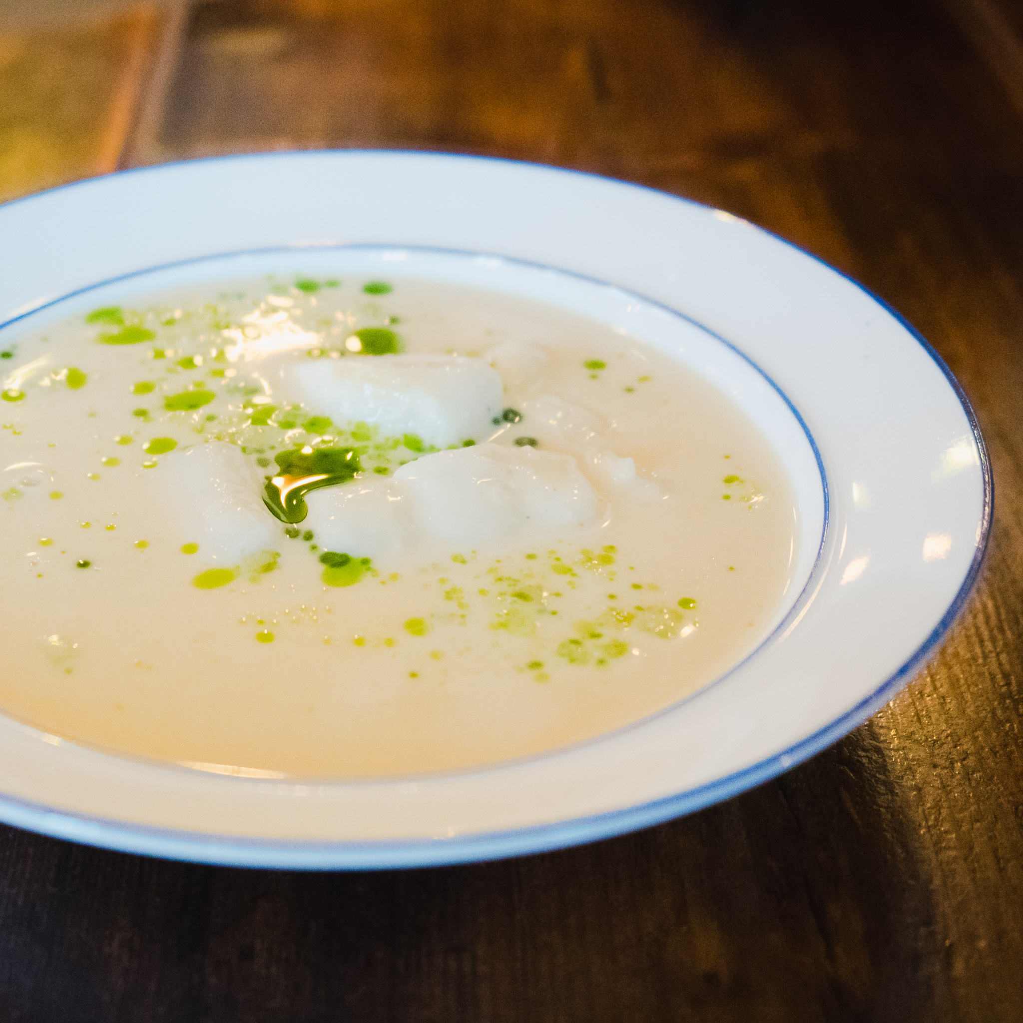 course 5, icelandic menu. halibut soup with mussels, apples and raisins.