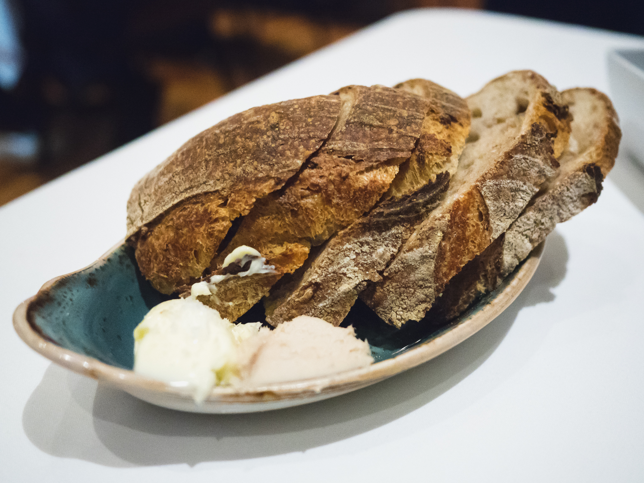 house bread with salted butter and smoked lardo.