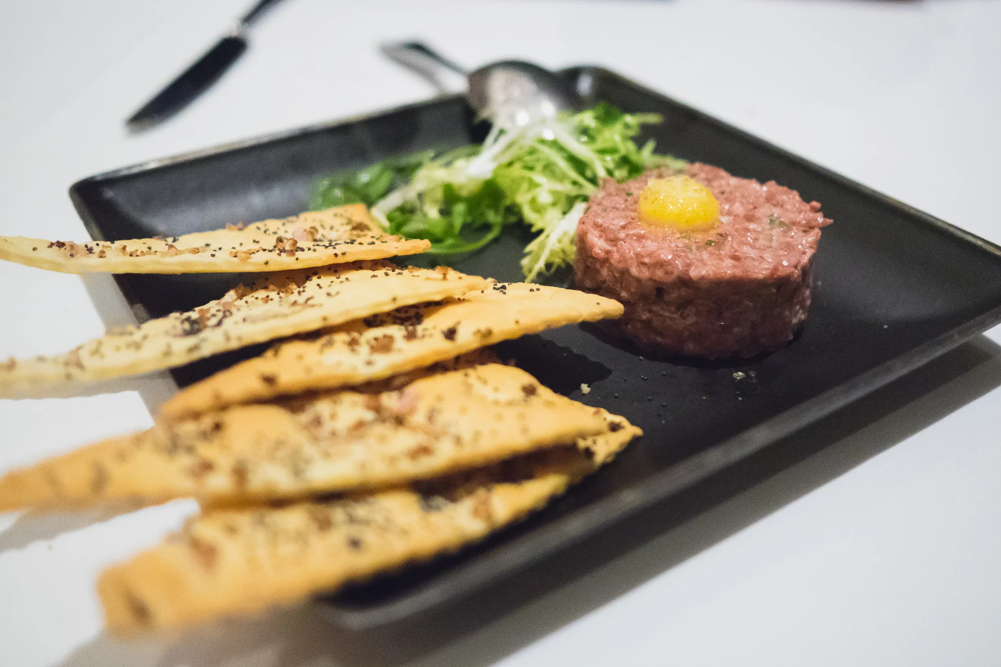 montana wagyu steak tartare with capers, cornichons, aioli, crackers.
