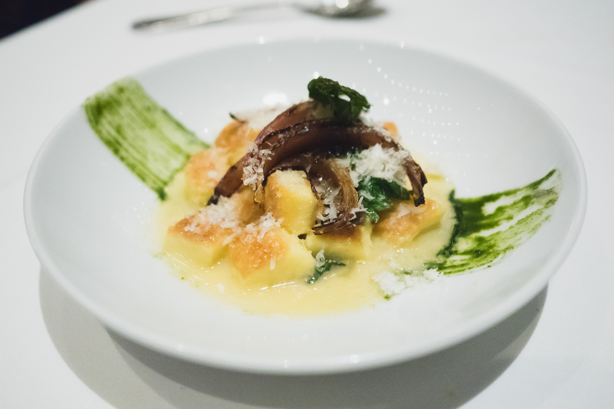 semolina gnocchi with nettles, pine nut "risotto", parmigiano-reggiano, nettle chips.