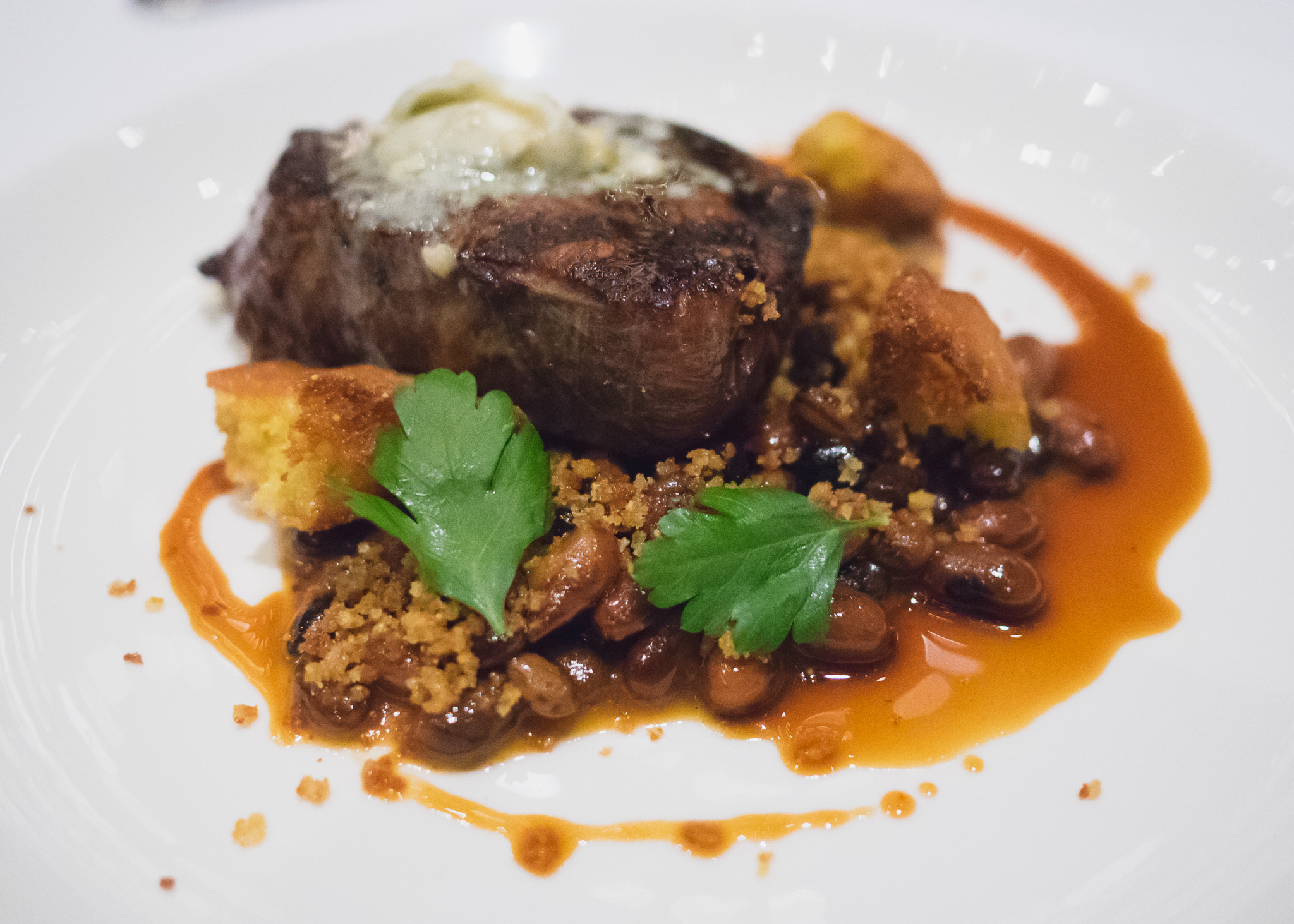 bison tenderloin with maple bbq rockwell beans, blue cheese, cornbread croutons.