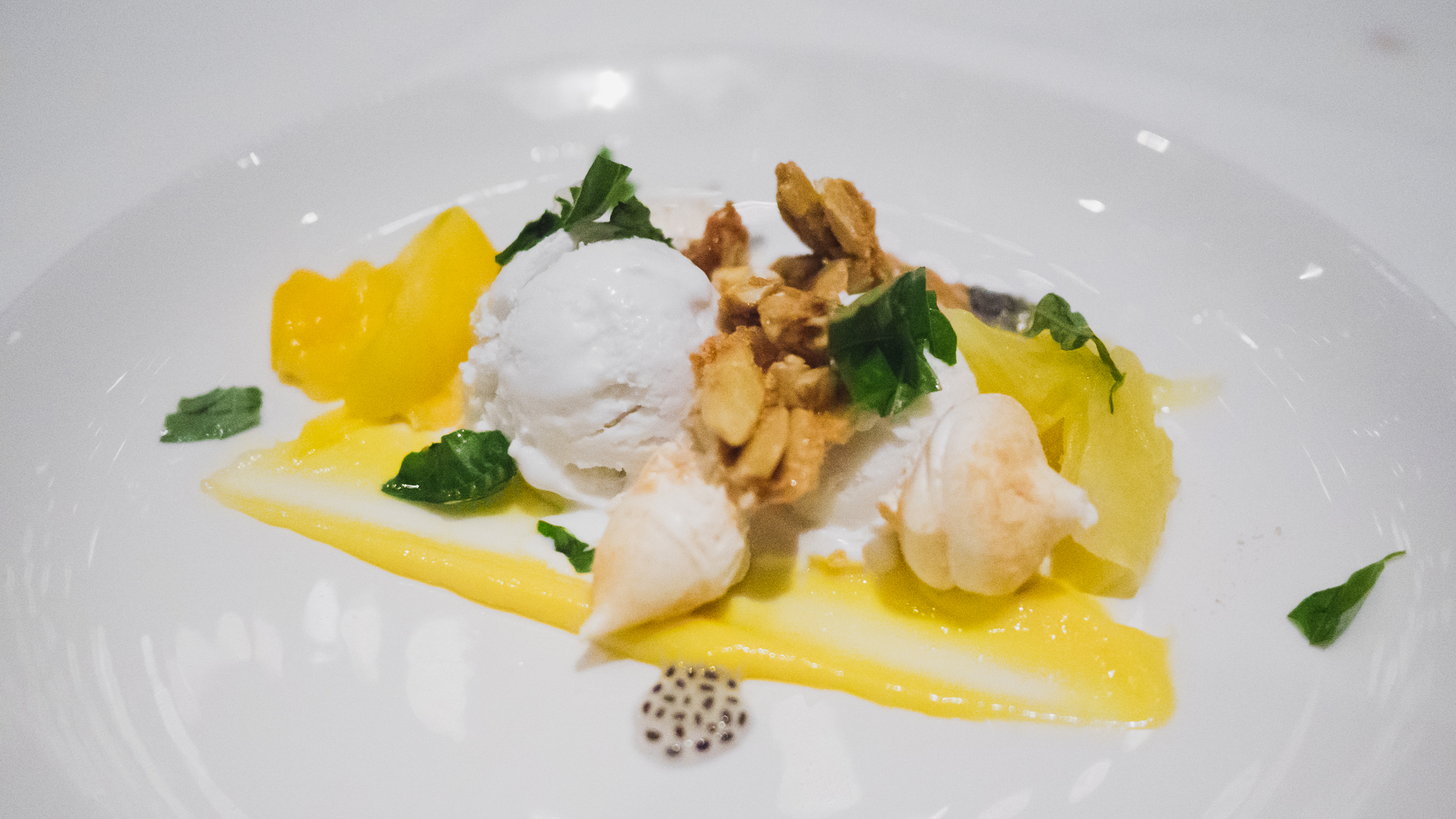 coconut sorbet with passionfruit curd, basil seeds, pili nut crumble and coconut meringue.