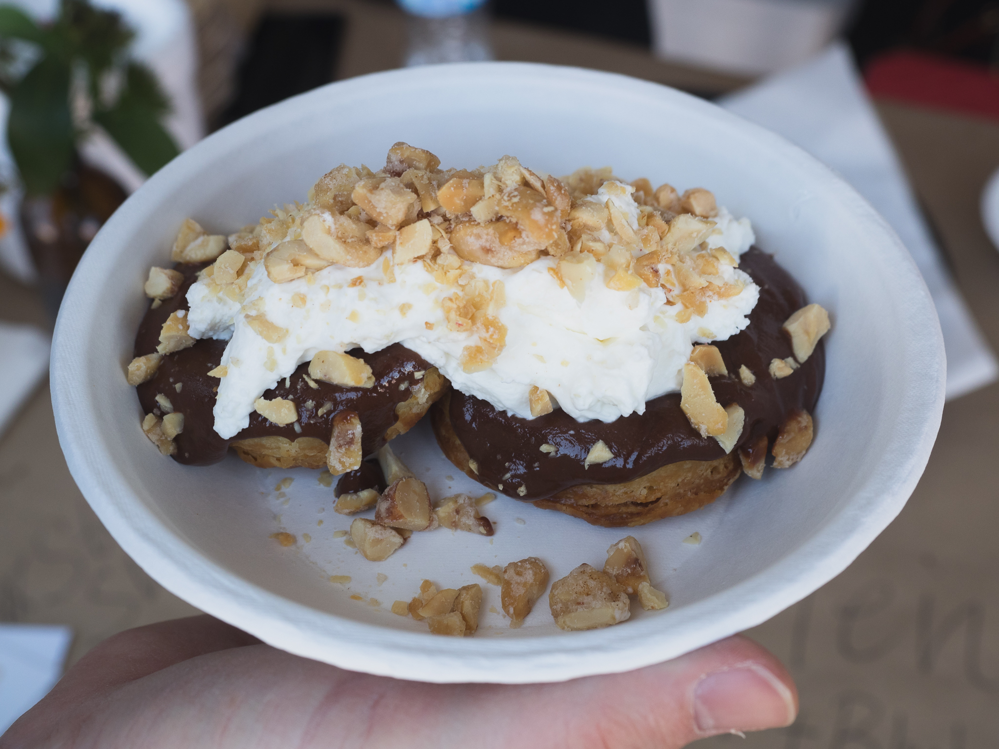 biscuit with chocolate sauce, whip cream and spicy peanuts.