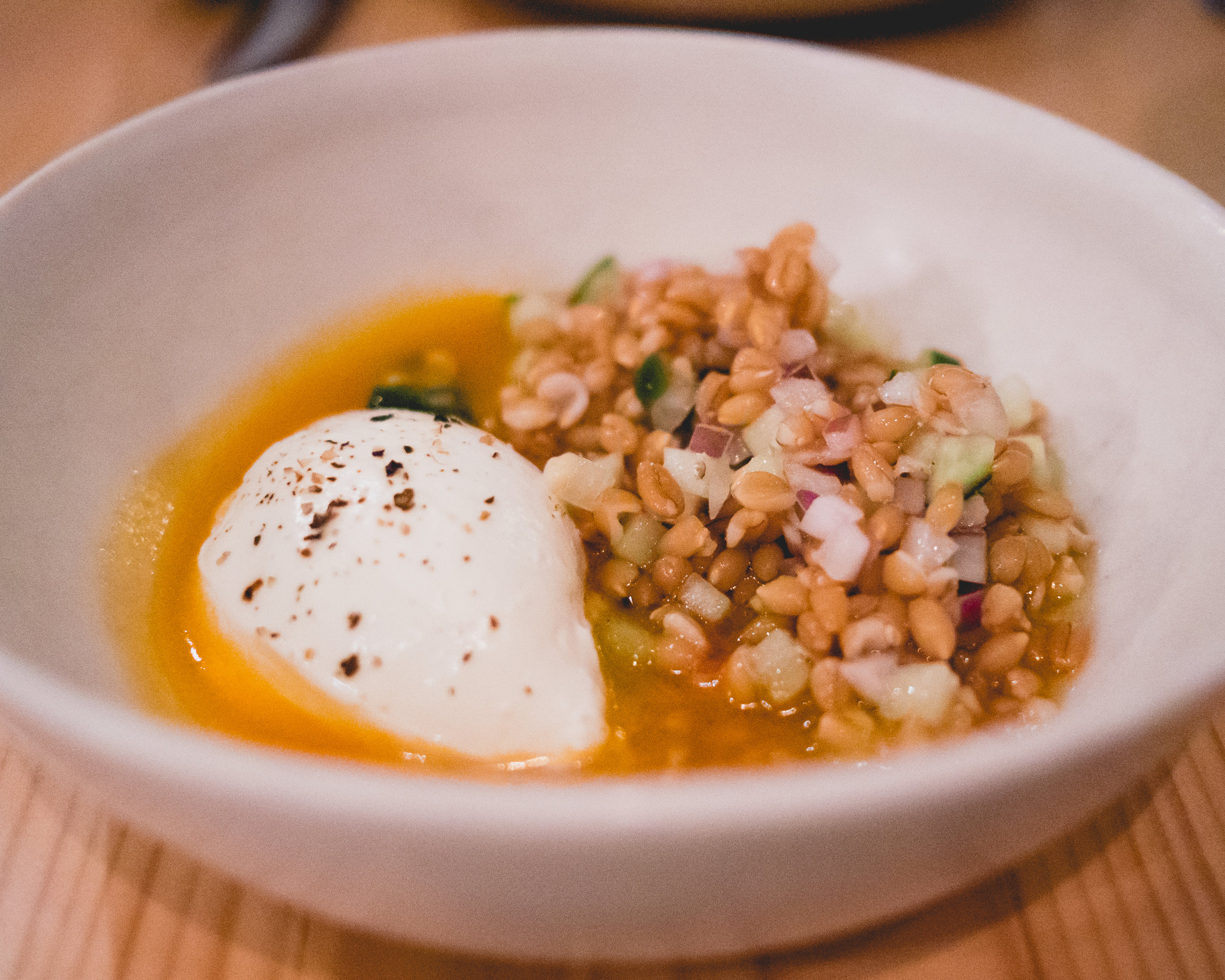 (dimsum) arugula and chevre salad , emmer, cucumber, spring onion, tomato vinaigrette.