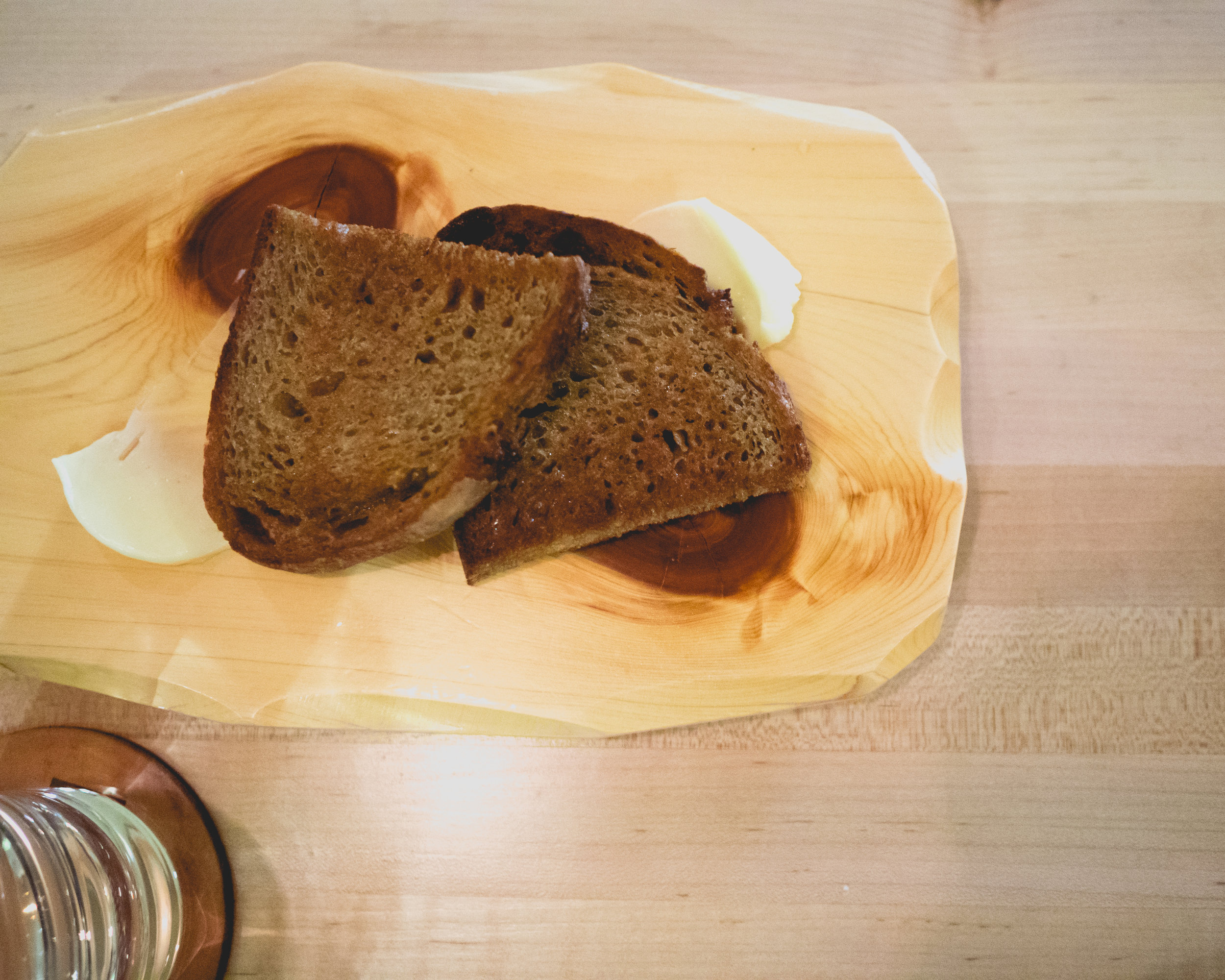 vi continued. sourdough with goat chop.