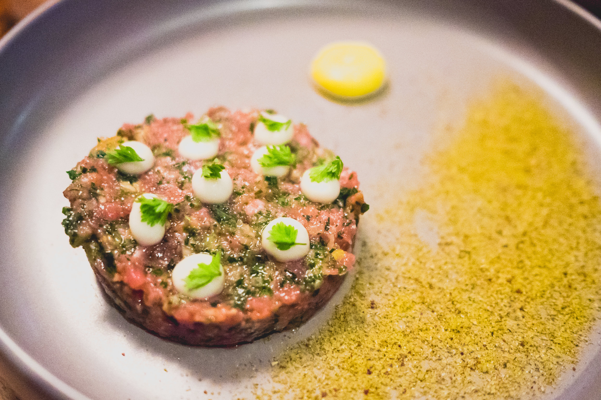 bison tartare, chamomile, sweet oion, preserved meyer lemon, hazelnut.