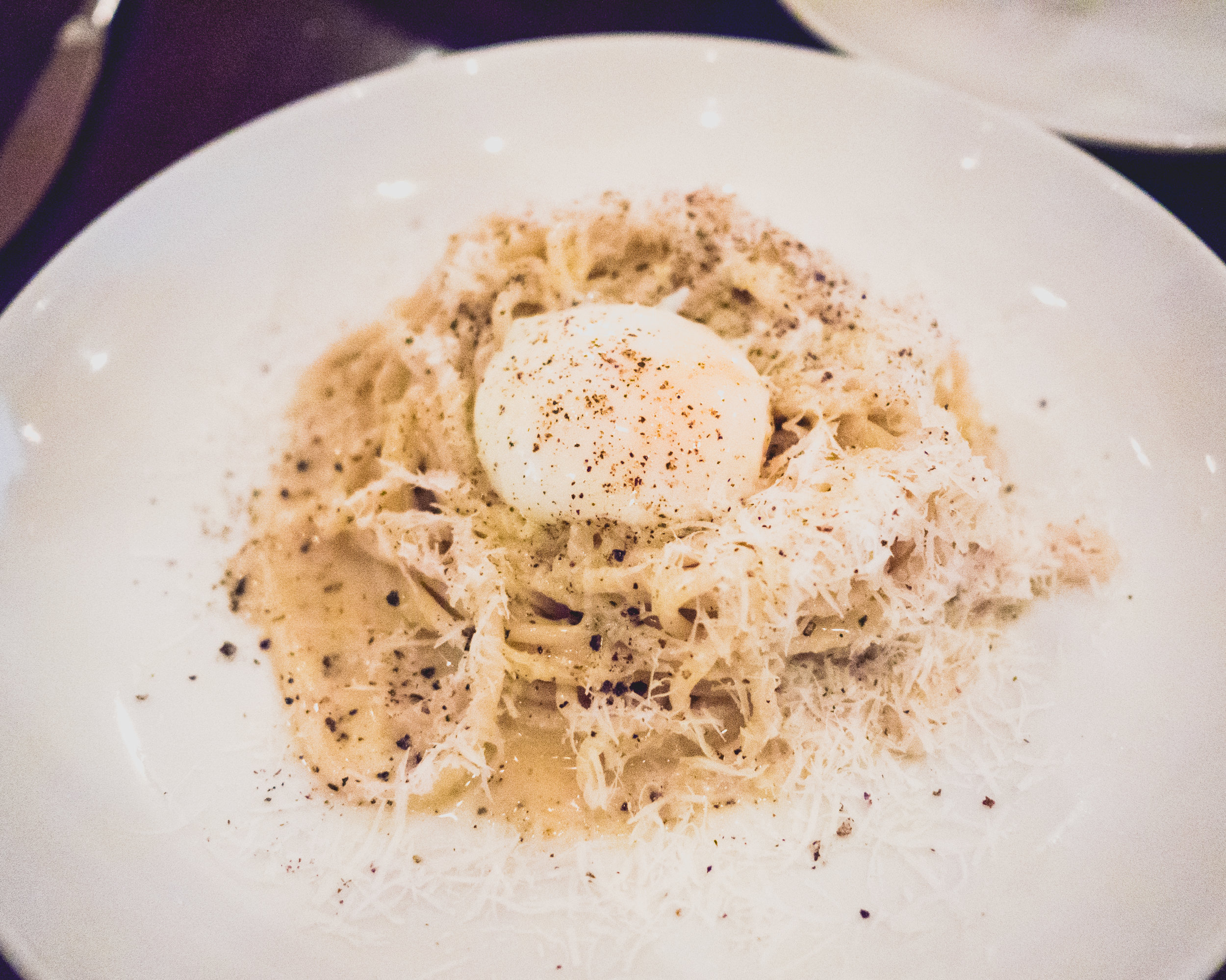 bucatini cacio e pepe with pecorino-romano, black pepper, 63-degree egg.