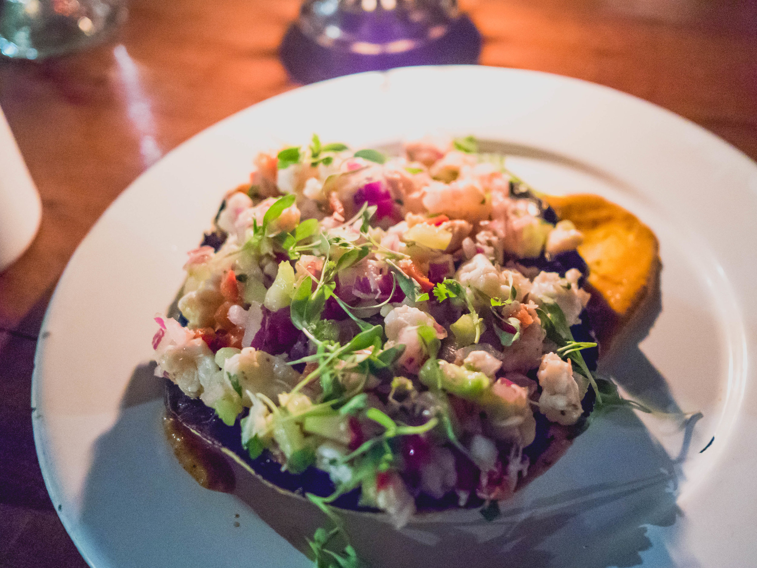 seafood tostada : shrimp, snapper, crab squid ink guacamole.