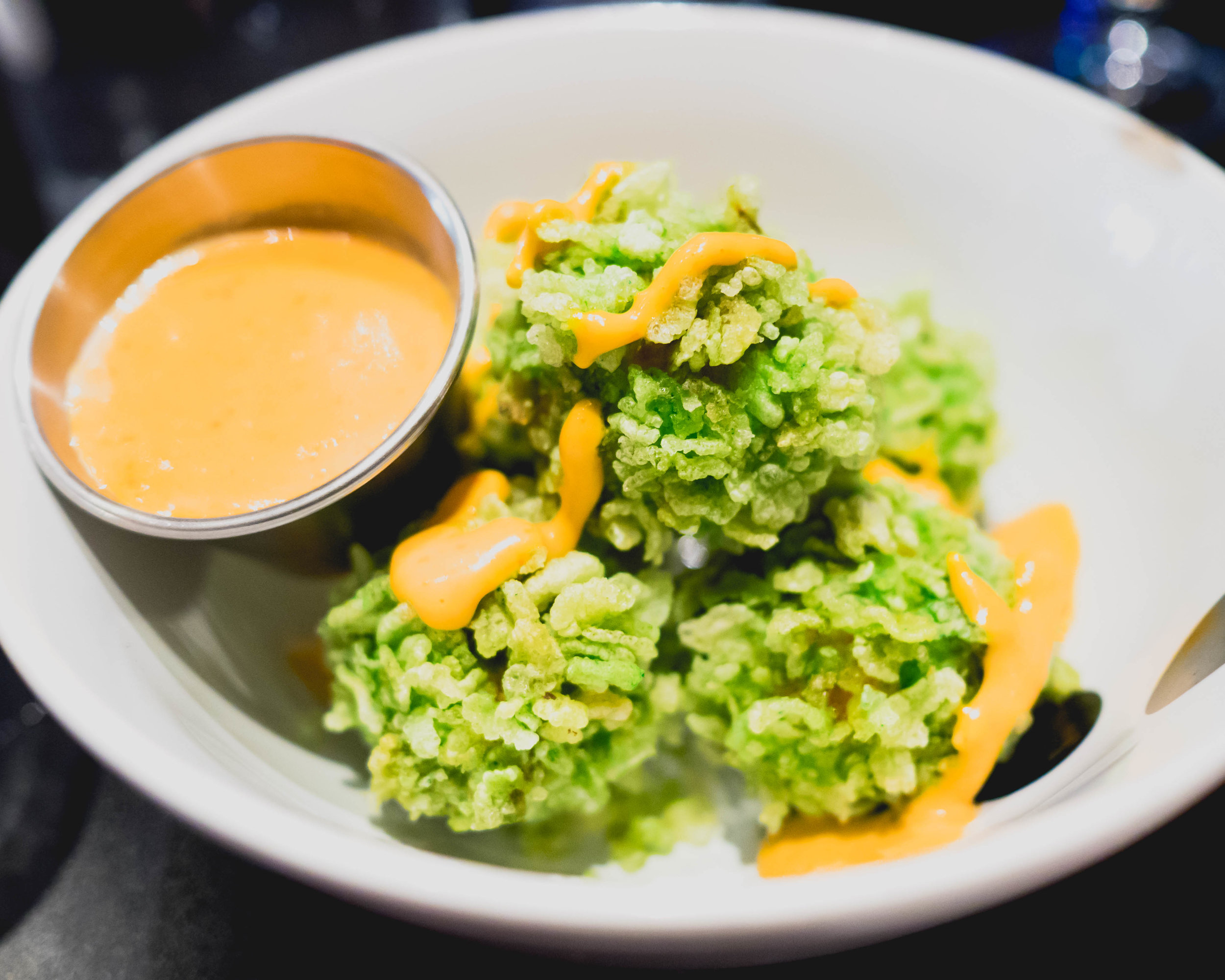 crispy tofu balls with fresh corn, green onions and housemade sriracha aioli.