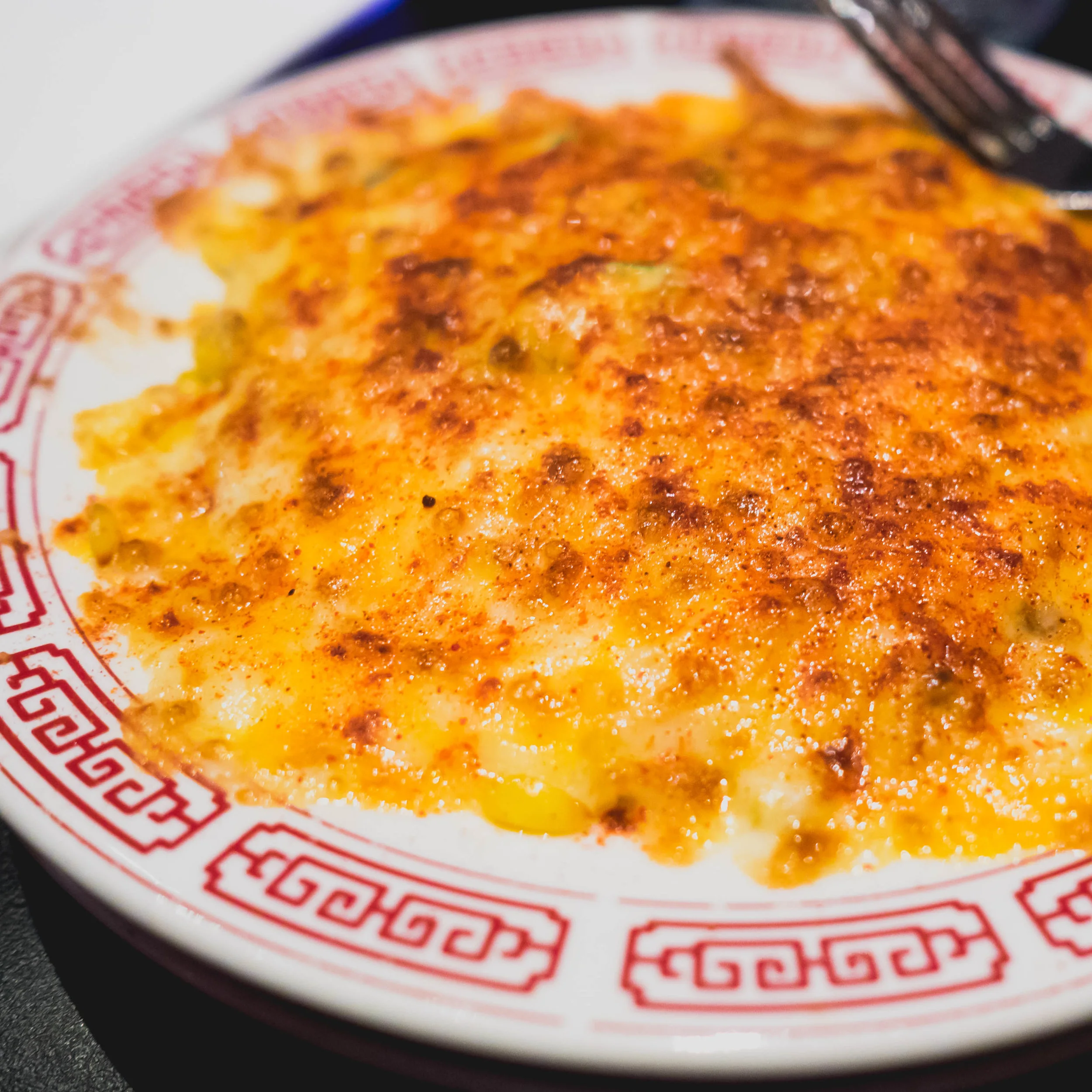 cheese corn with japanese kewpie mayo, salted plum powder, smoked paprika.