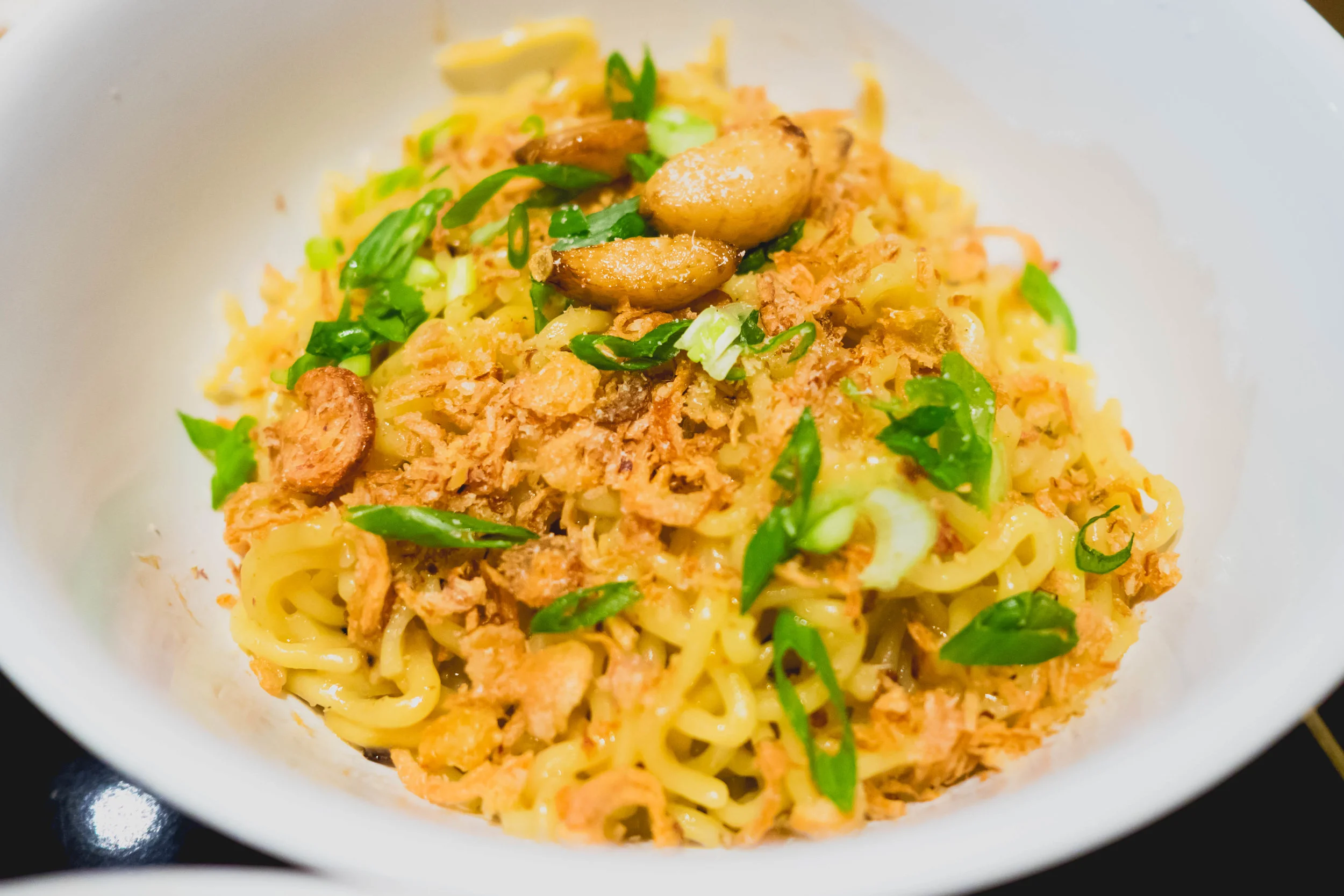 garlic noodles : fried ramen noodles, clarified brown butter, oyster sauce, chicken fat.