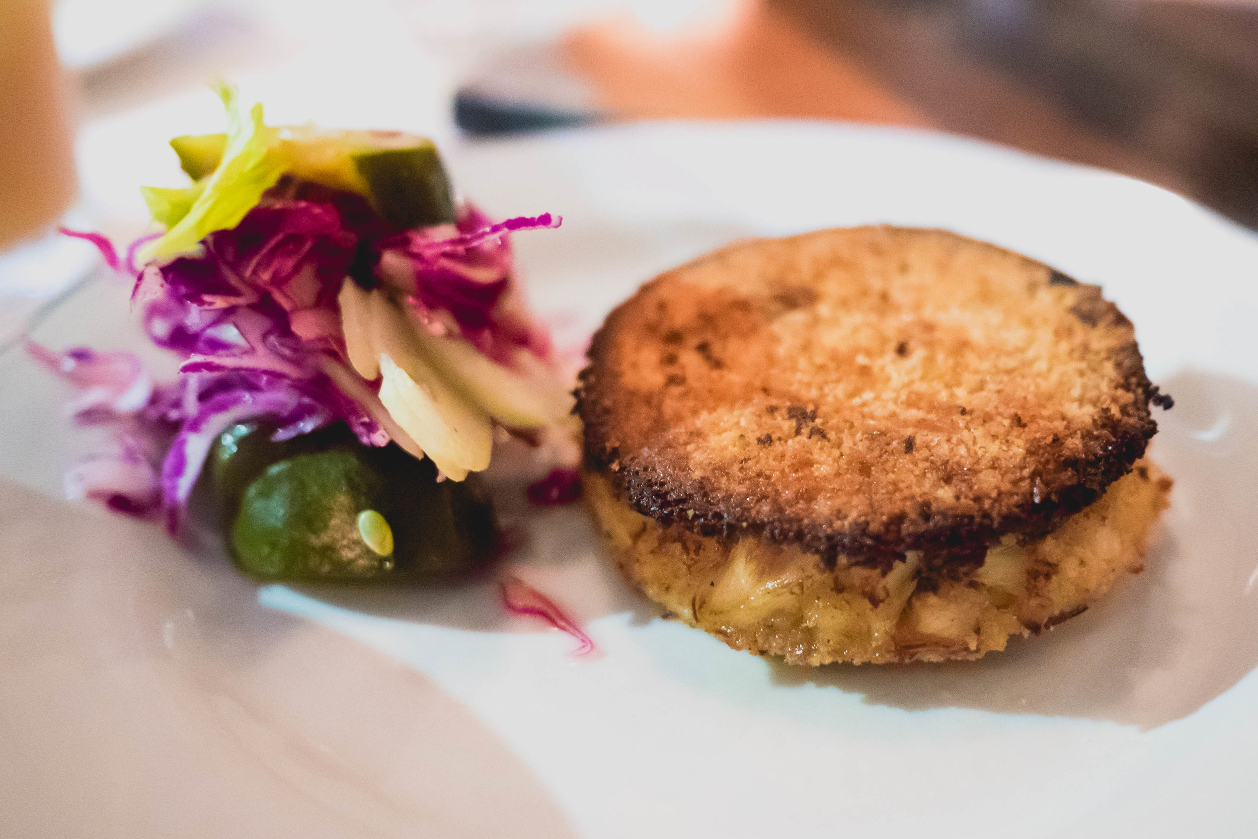 maryland blue crab cake , in-house dill pickles, whole grain mustard remoulade.
