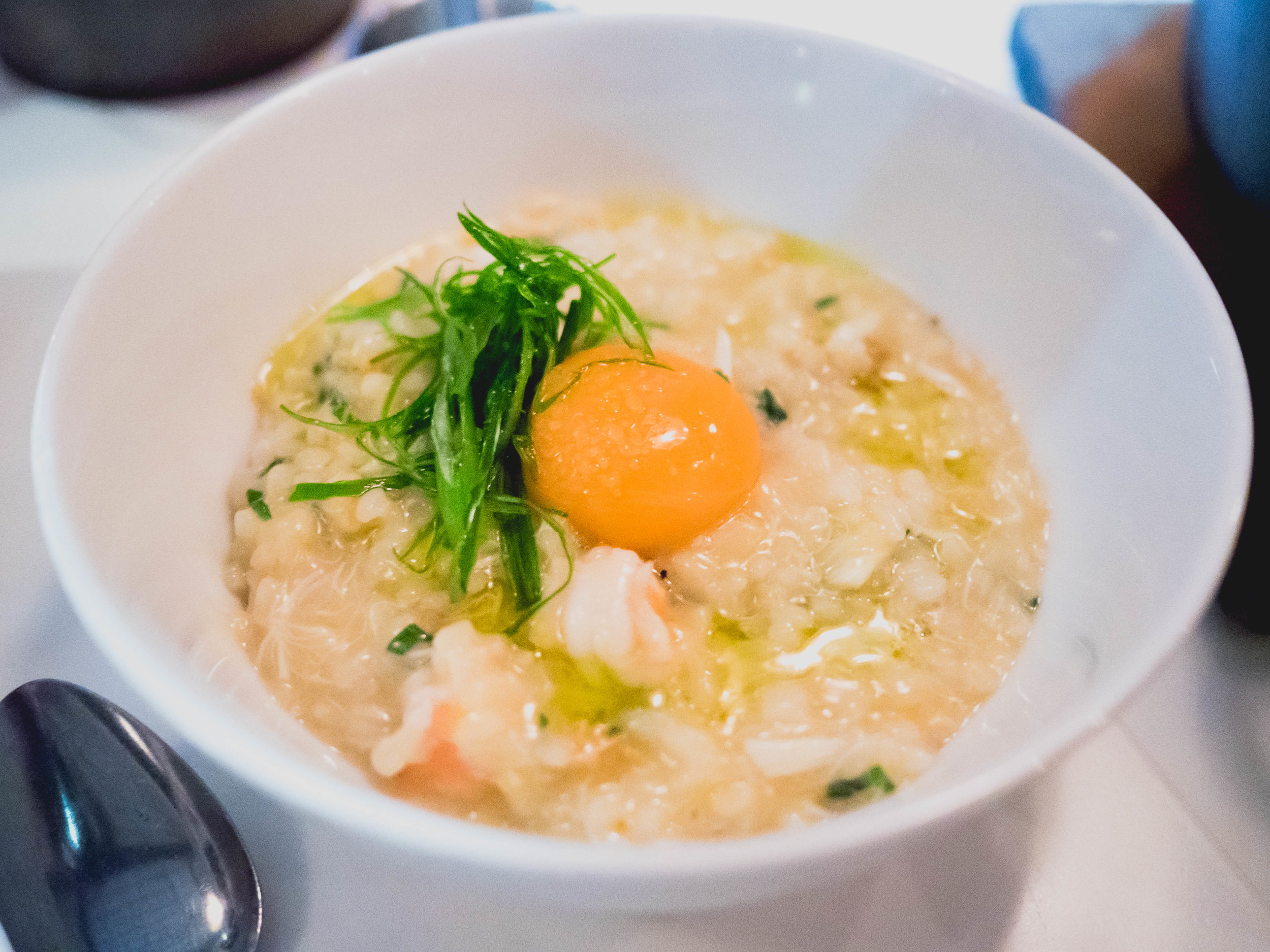 koshihikari rice with chicken dashi, blue crab, shrimp, uni, egg, basil.