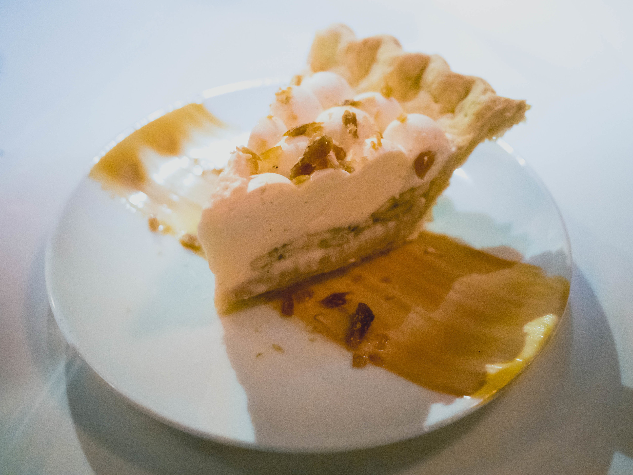 banana toffee cream pie with toffee, fresh bananas, vanilla whipped cream.