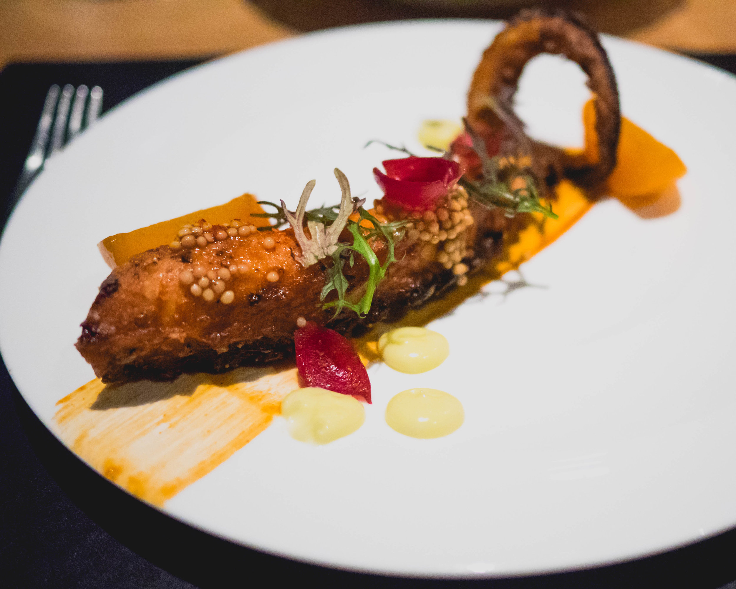second course: grilled octopus , persimmon, lemon, mustards, pickled pearl onion, herbs.