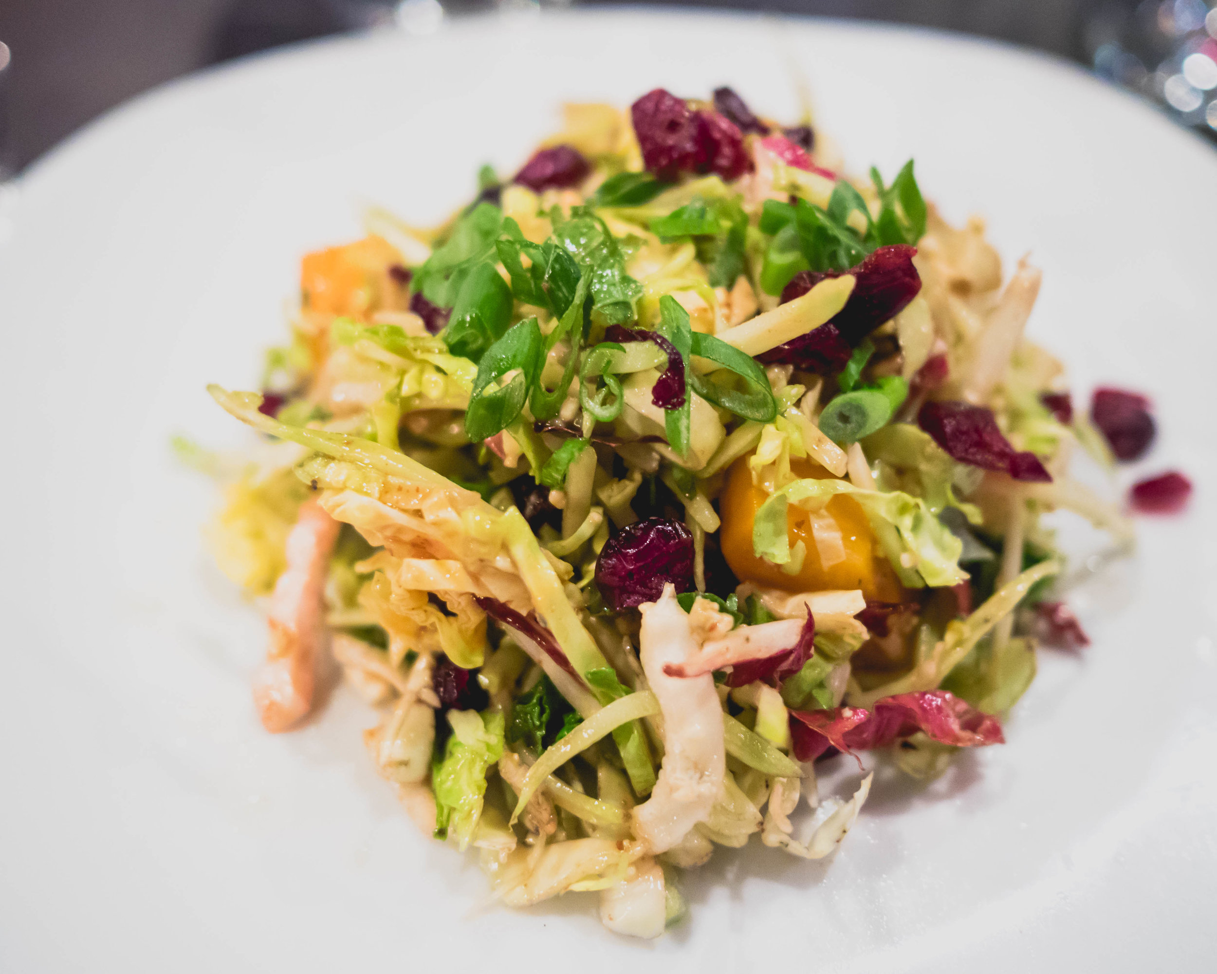 roasted butternut squash salad with craisins, apple, green onions, crumbled blue cheese, applejack vinaigrette.