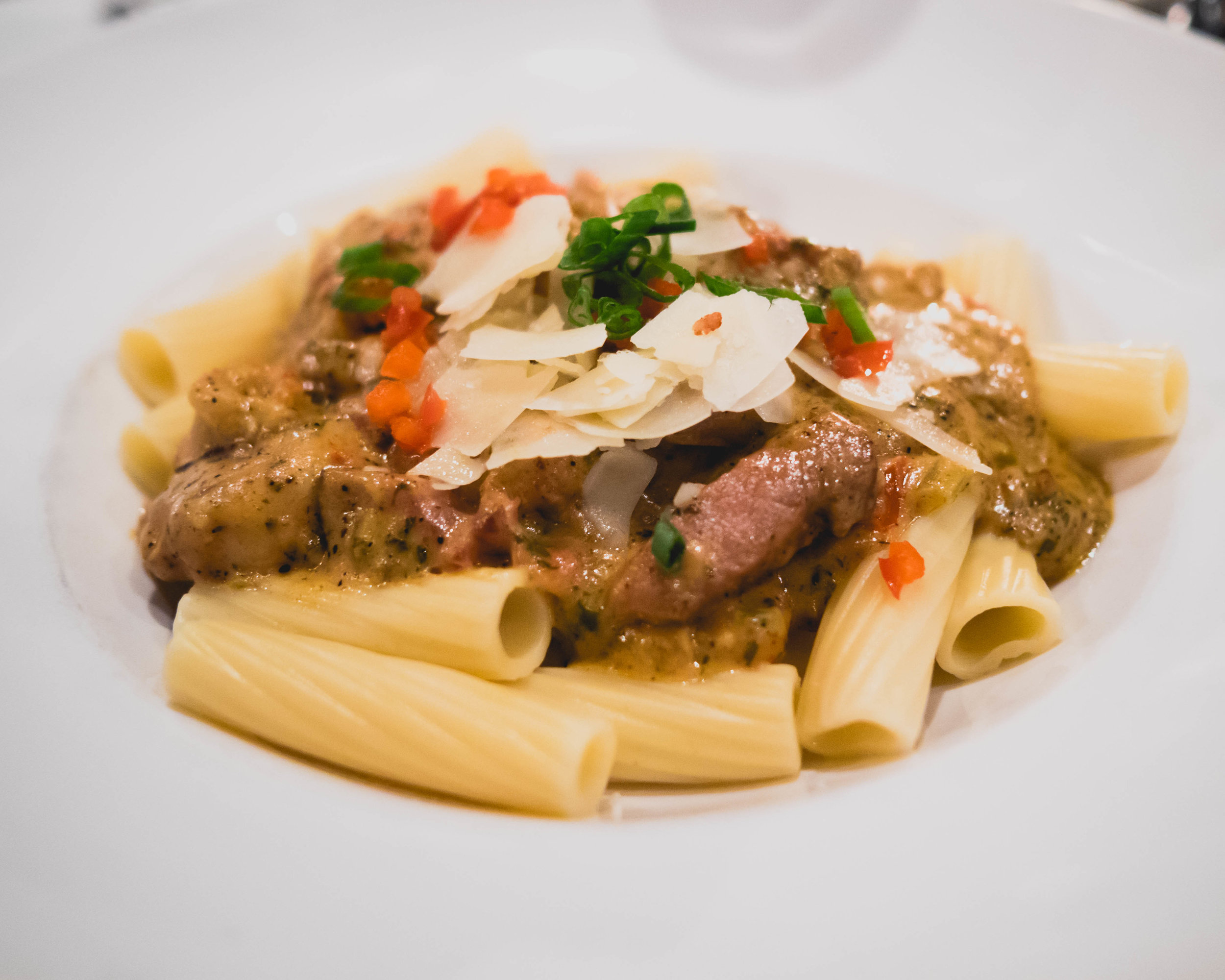 rigatoni creole with alligator, tasso, shrimp, crawfish, creole cream.