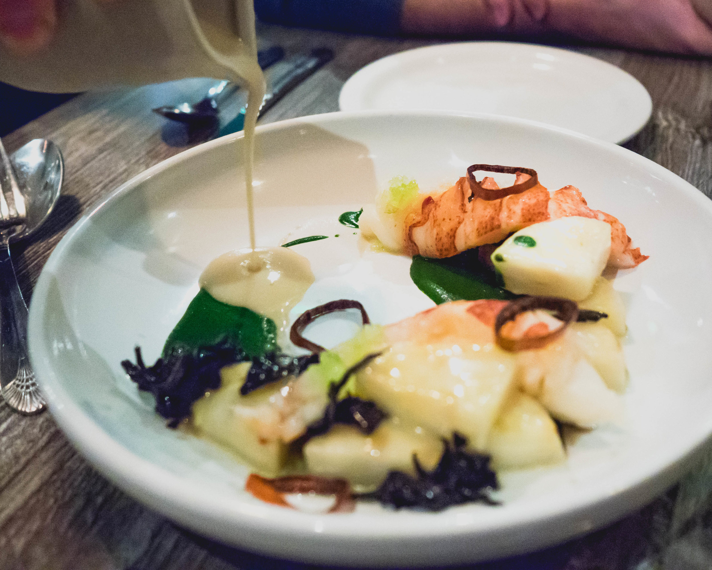 pouring celery root veloute.