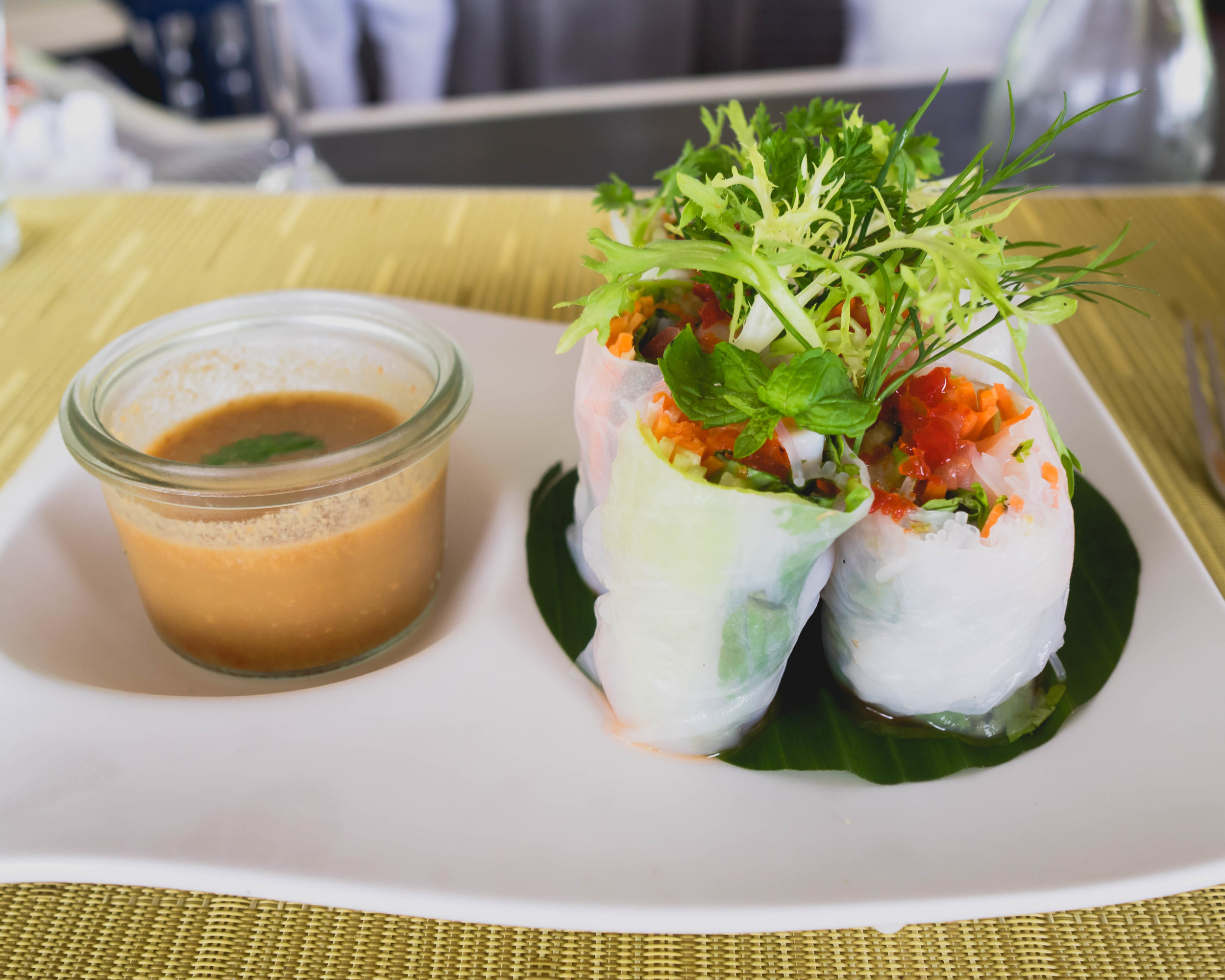 veli bar's vietnamese prawn rice paper rolls with indian ocean prawn, bean sprouts, lettuce, rice noodles, carrots, mint, spicy peanut dip.