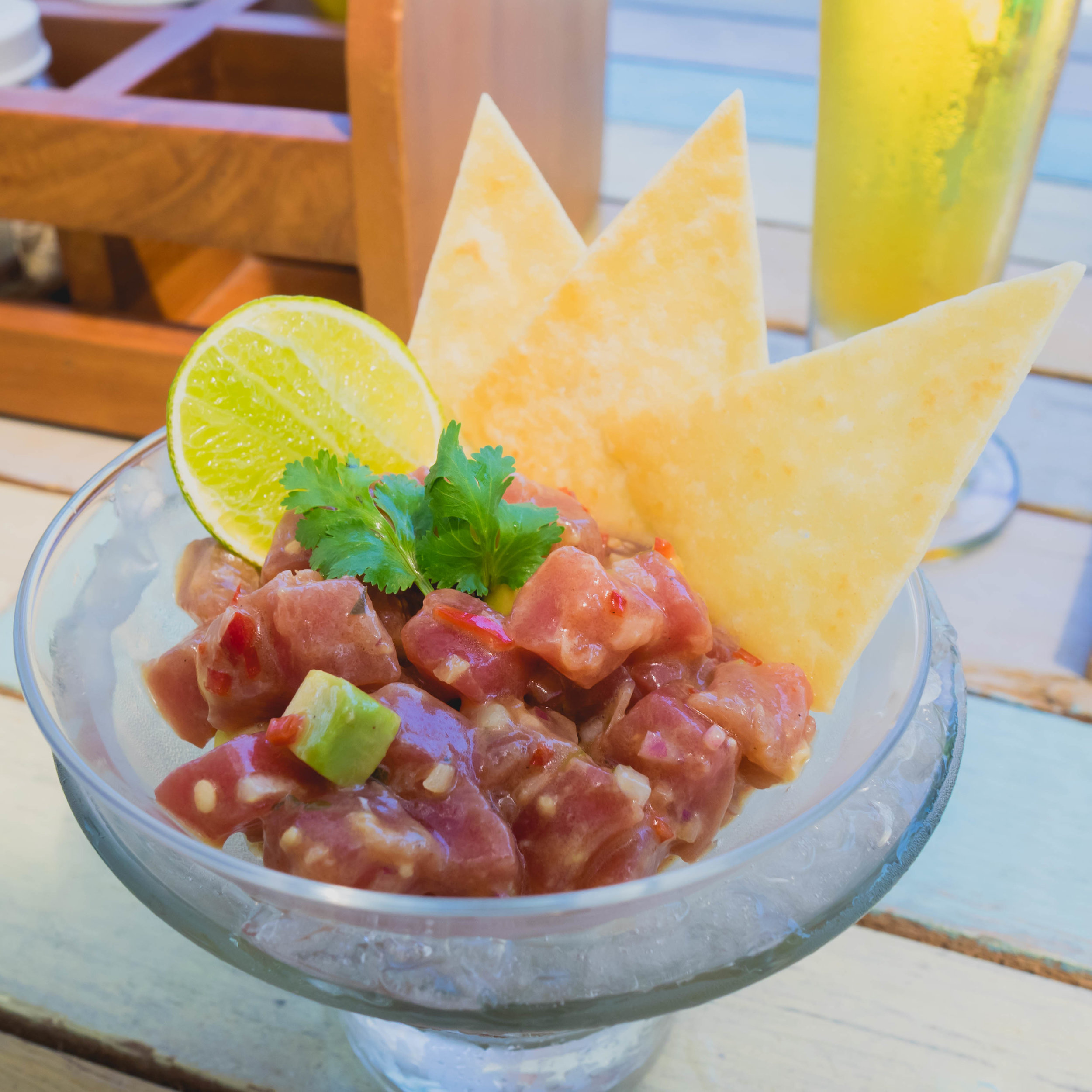 tuna tartare at lagoon bar with chilli, black pepper, olive oil, shallots, kaffir lime, avocado, tortilla chips.