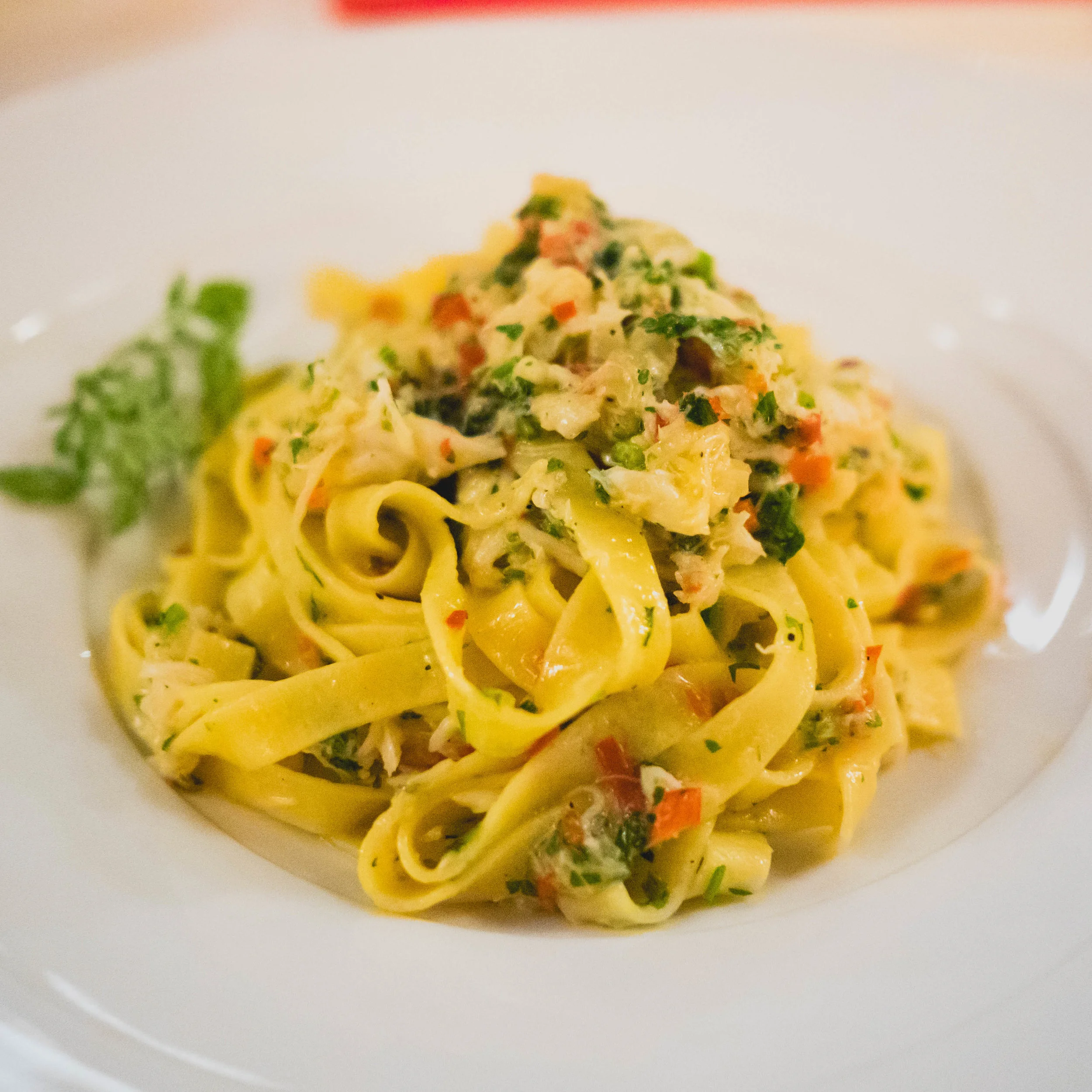 spicy crab fettuccine with chili, parsley and lemon at allegria.