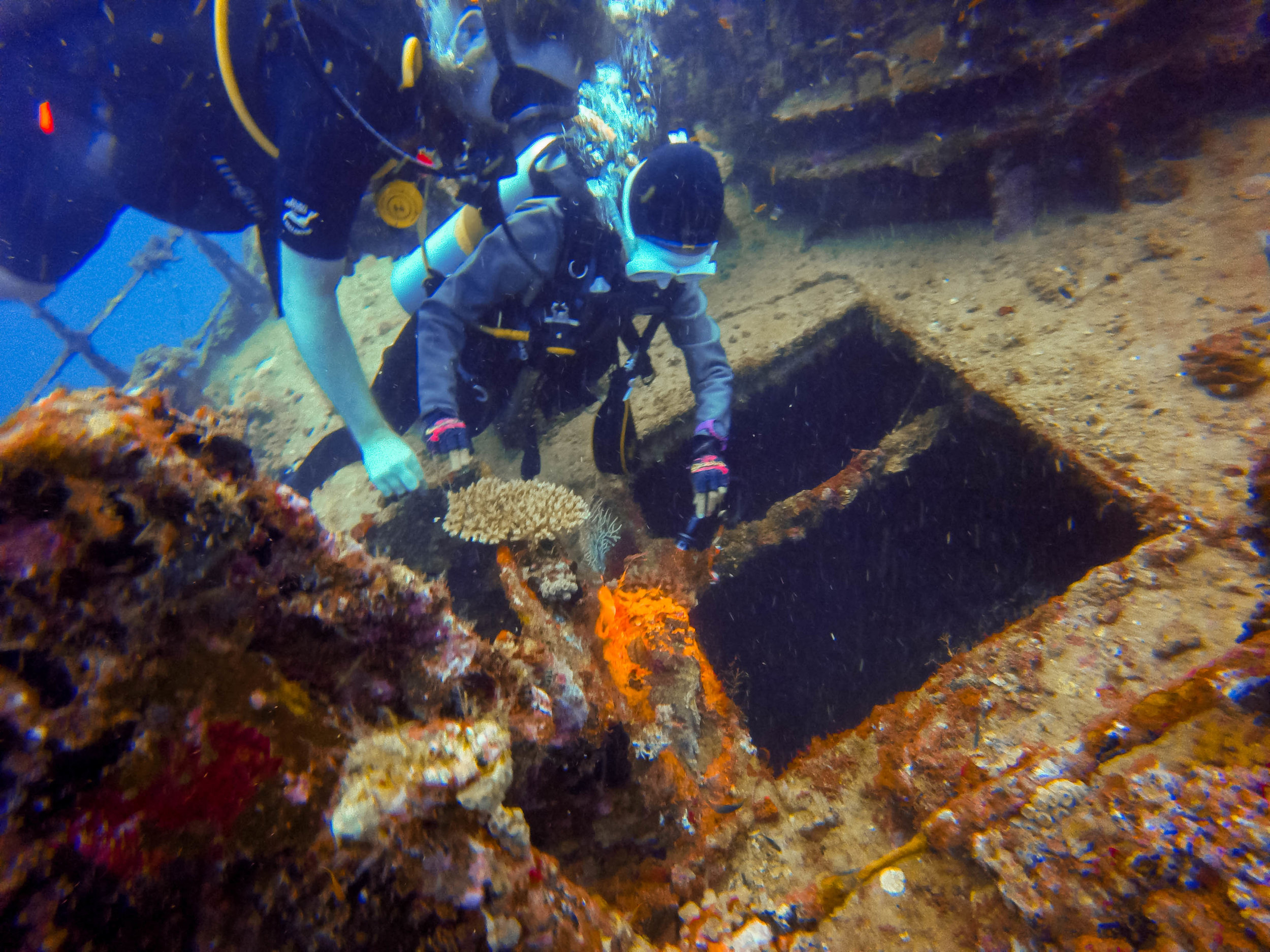 our guide pointing out a camouflaged stone fish. 