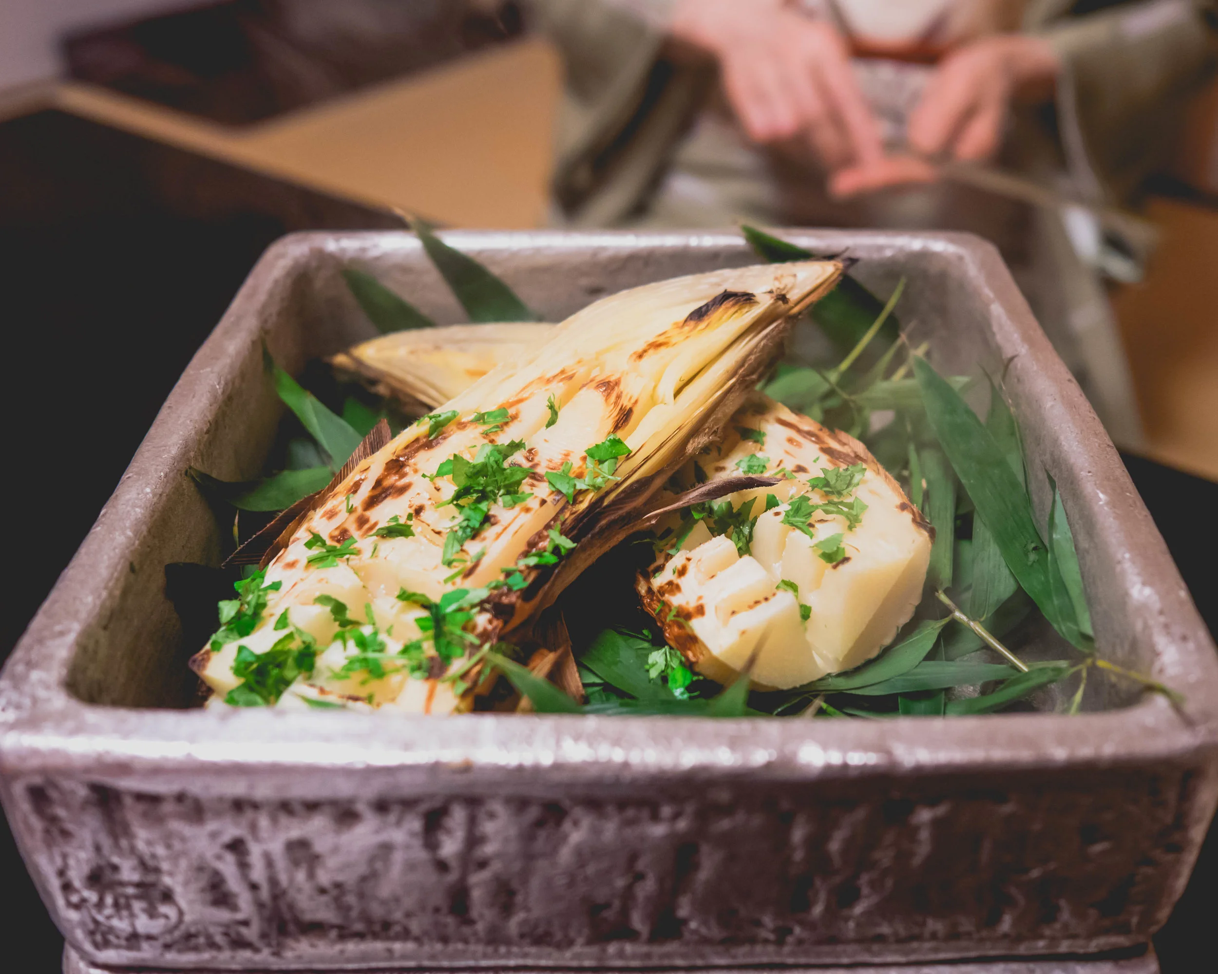 grilled bamboo shoot , salted sansho pepper oil, salt and seville orange.