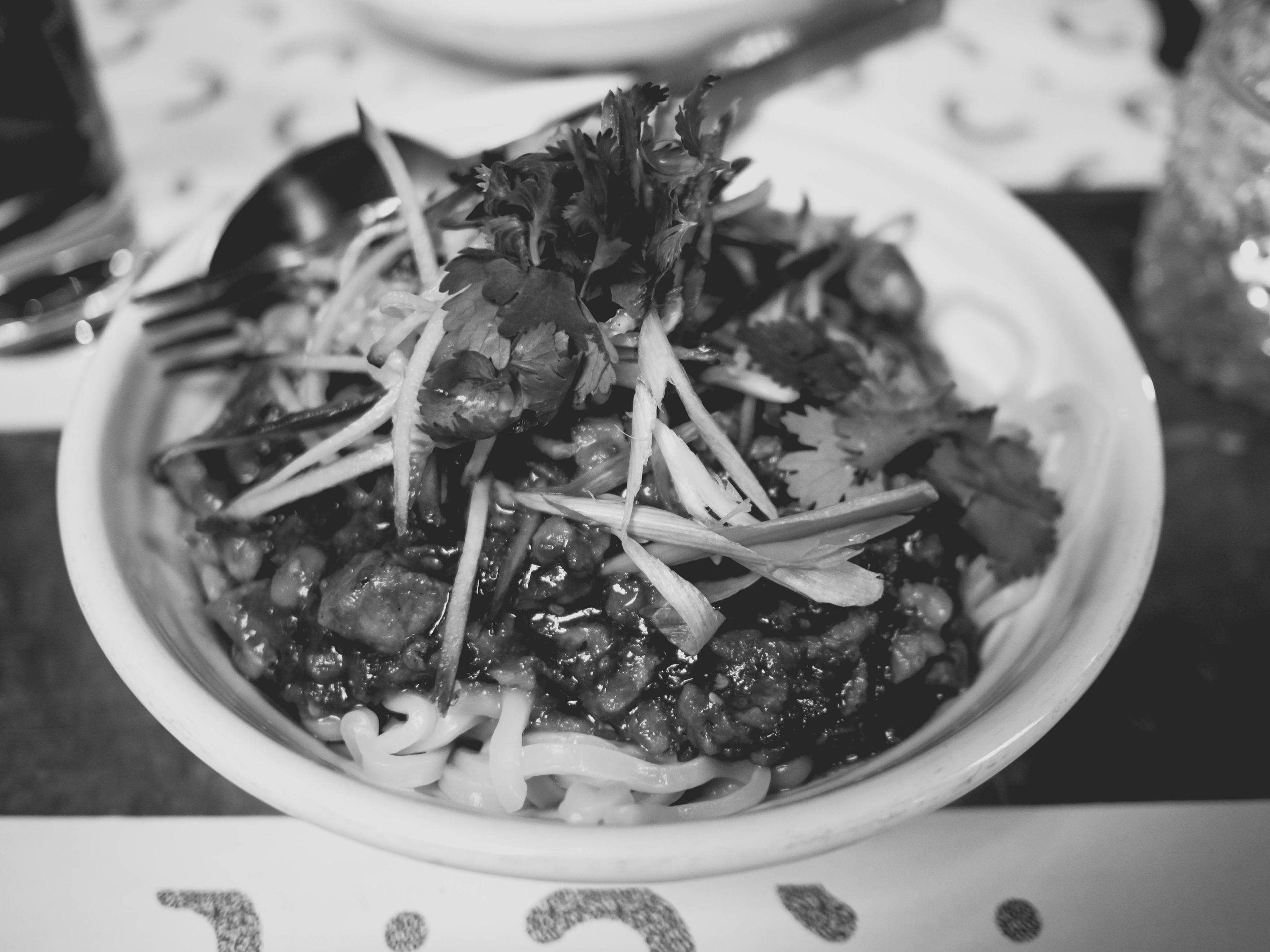 dan dan noodle with hand cut pork neck, szechuan, chili, sesame & green onion.