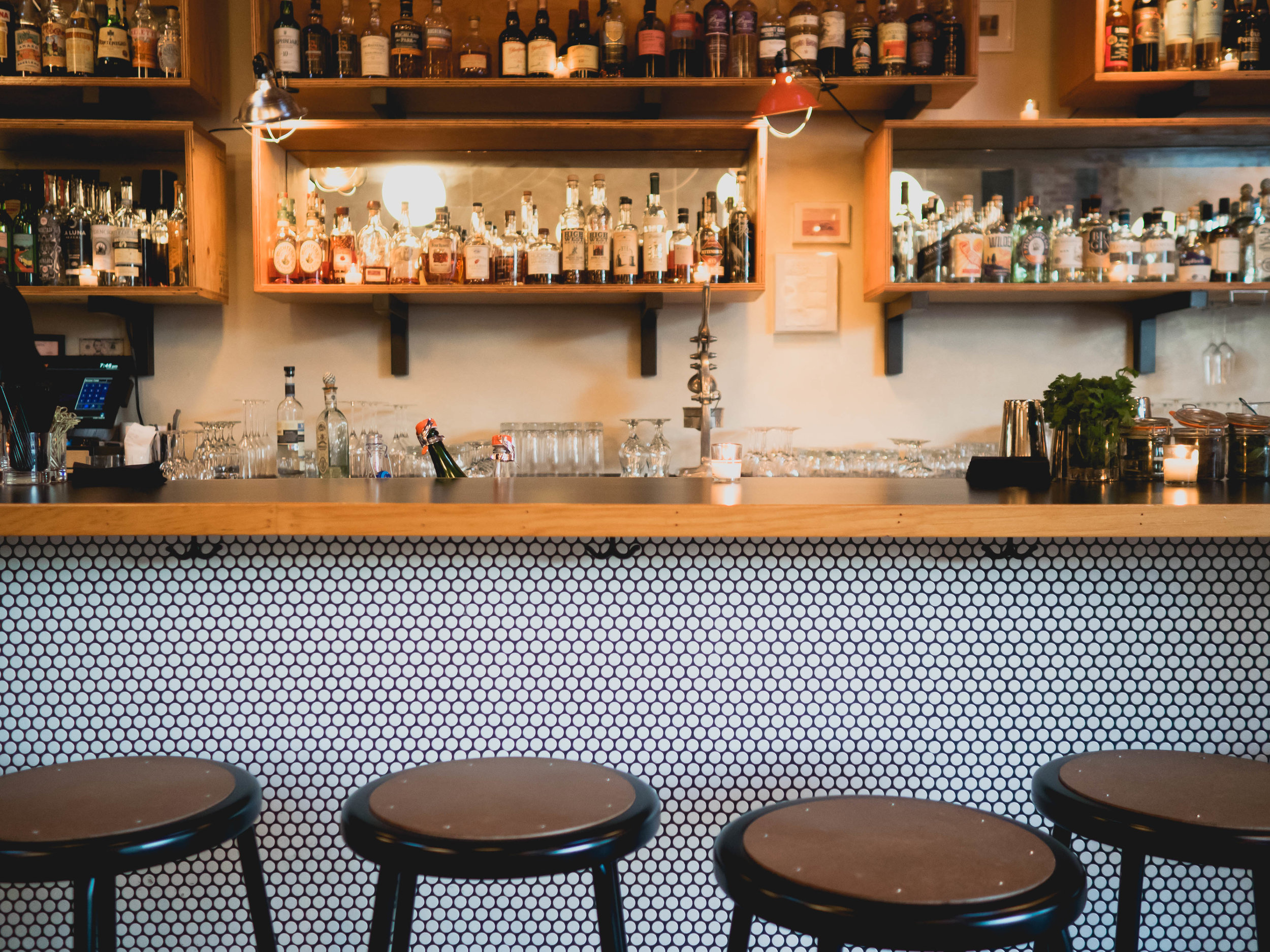love the penny round tile used on the bar.