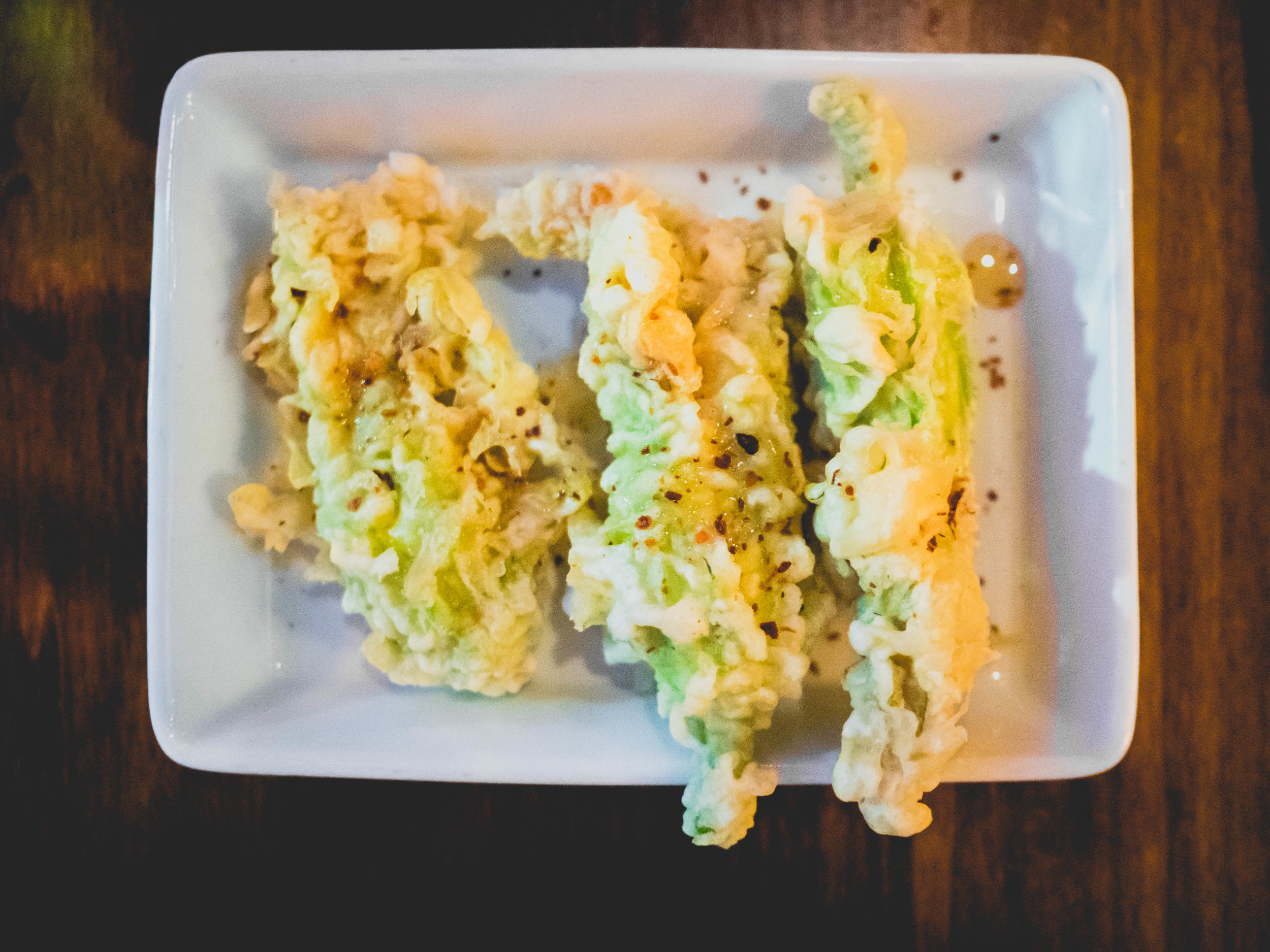 side of stuffed squash blossoms .