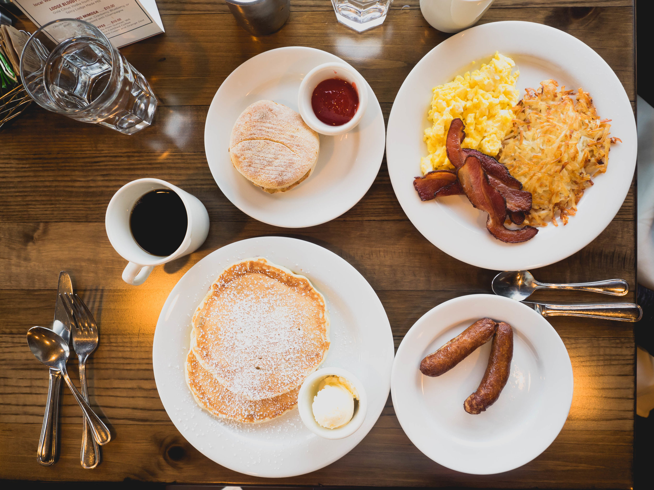 lodge breakfast : two eggs, hash browns, bacon, english muffin; buttermilk sourdough pancakes , side of chicken apple sausage.