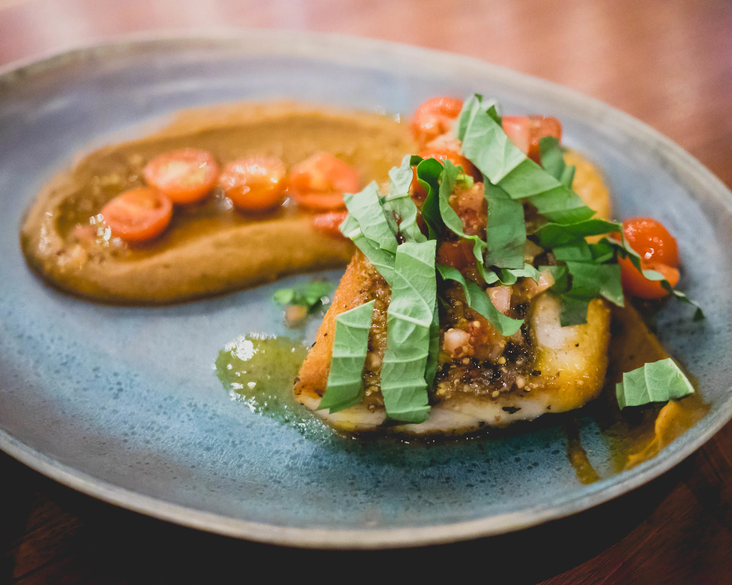 roasted seabass , sweet potato, mustard vinaigrette, cherry tomatoes.