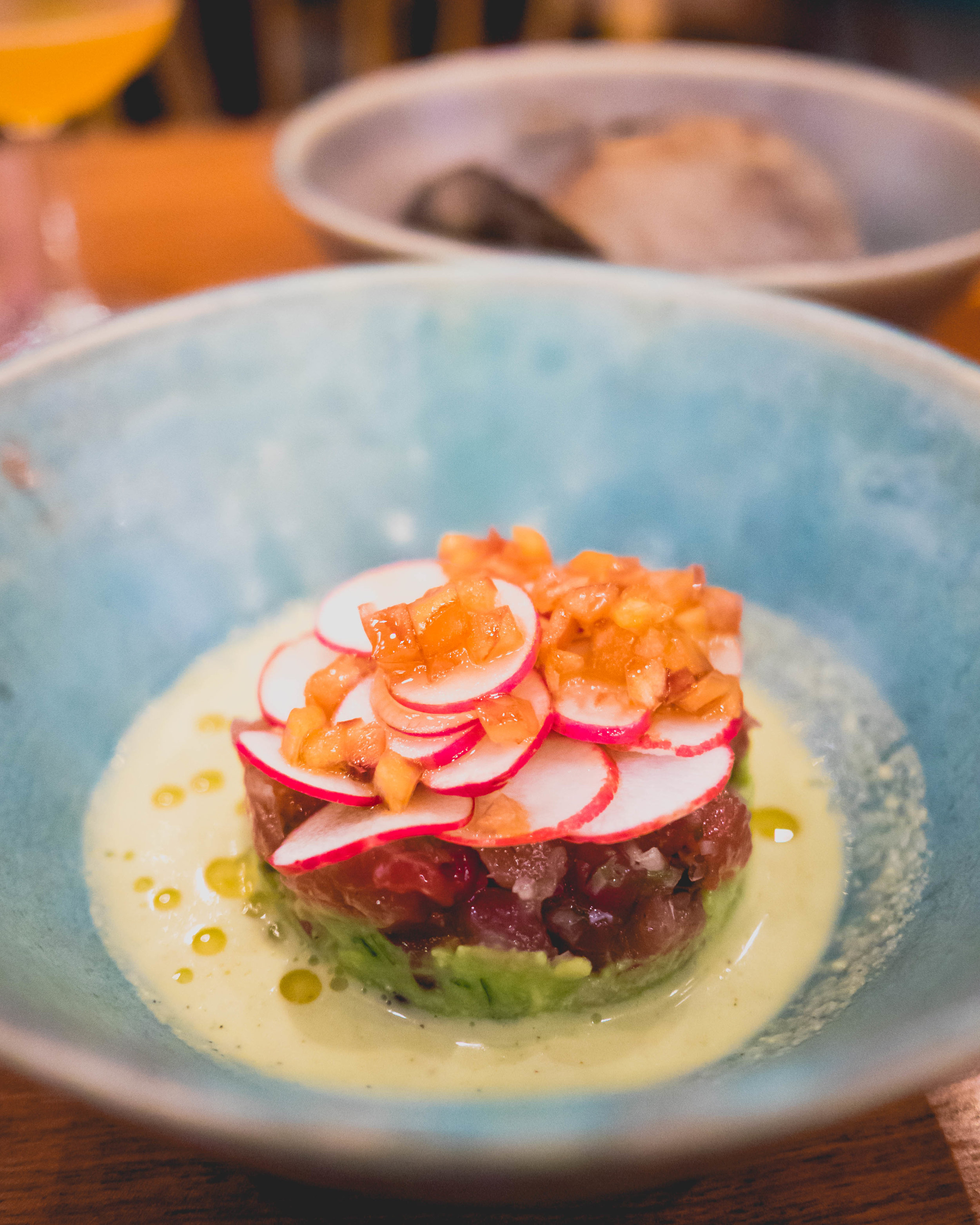 tuna tartare , jalapeno emulsion, radishes, chili oil, avocado.