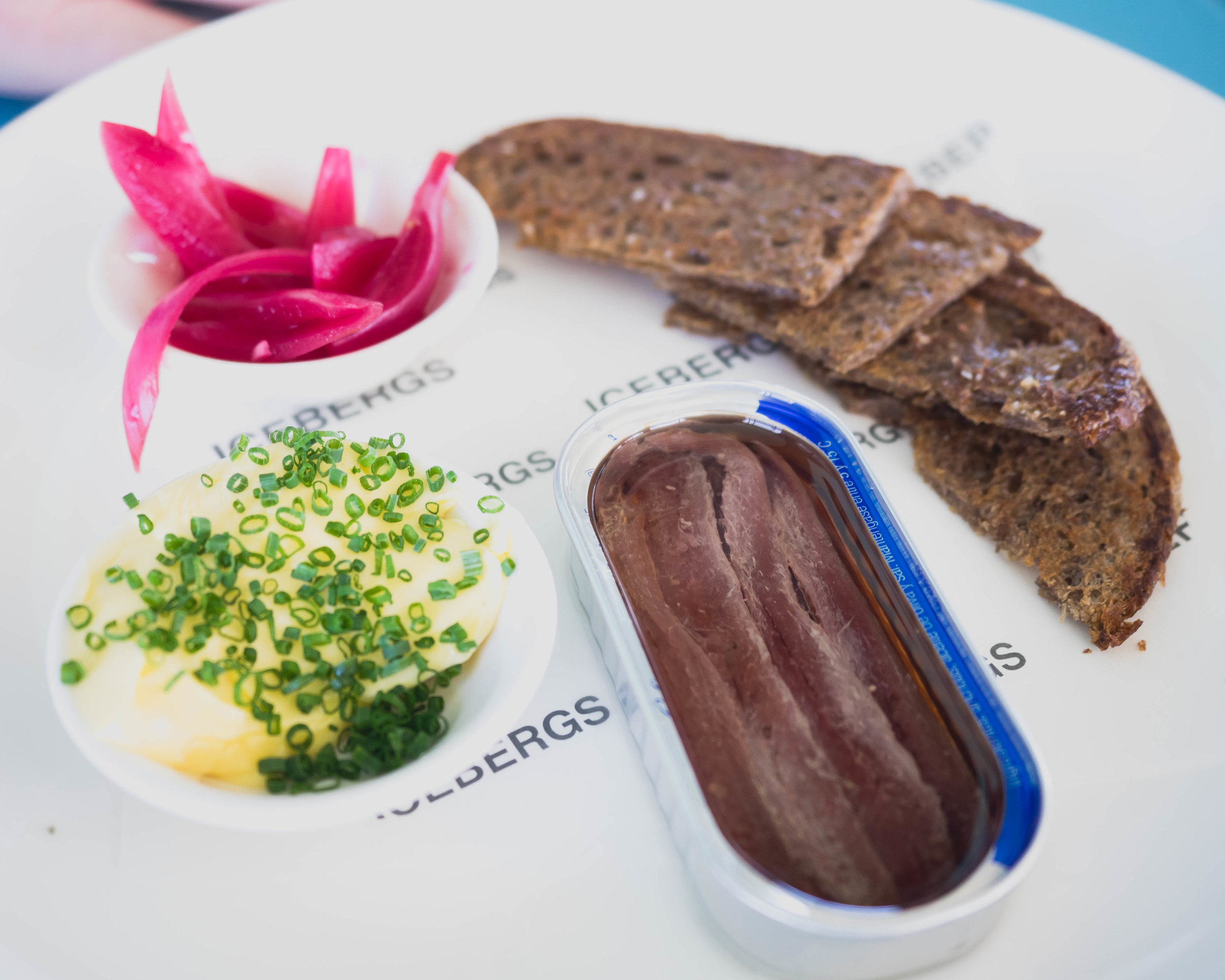 anchovies, toast, pickled onion .