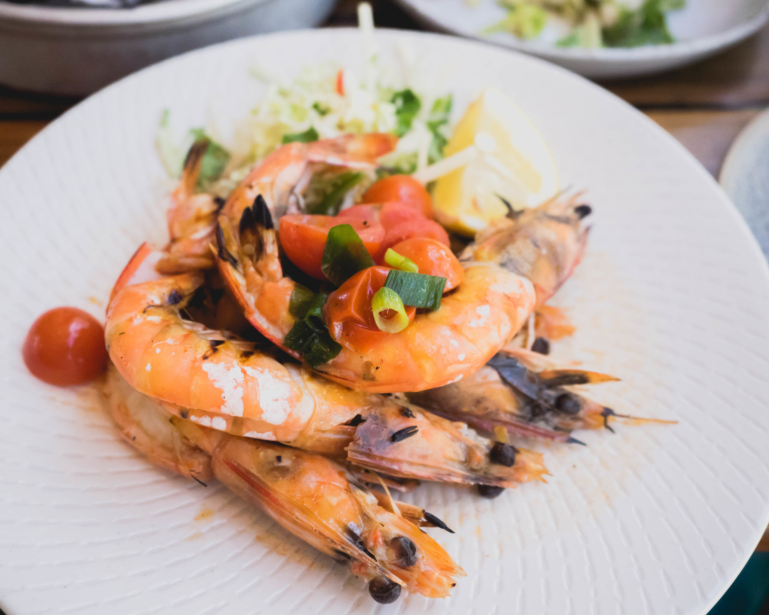 split and grilled yamba prawns with coriander, chipotle and lime butter.