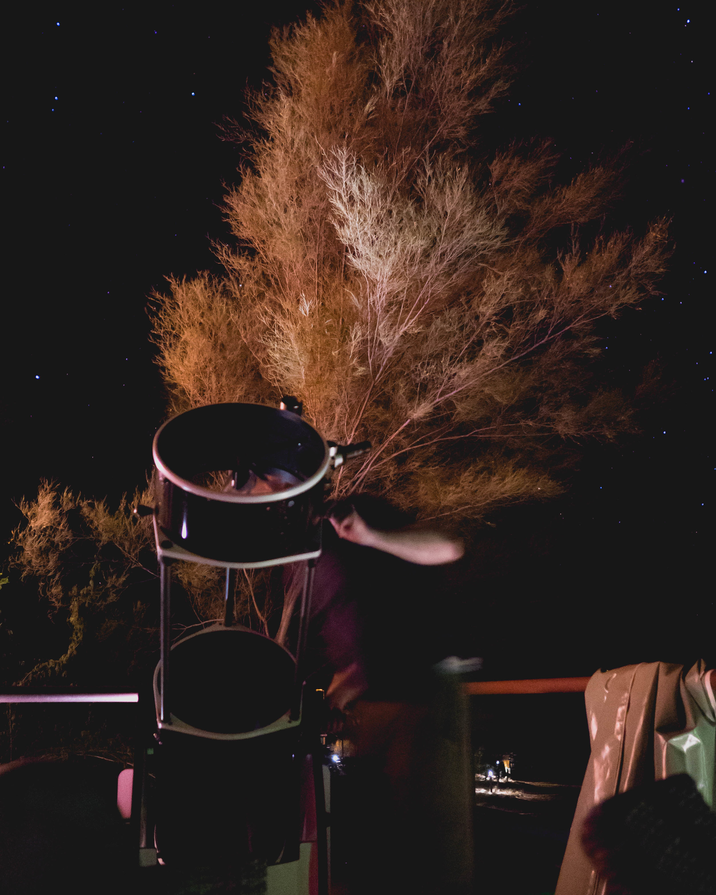 james using the telescope.
